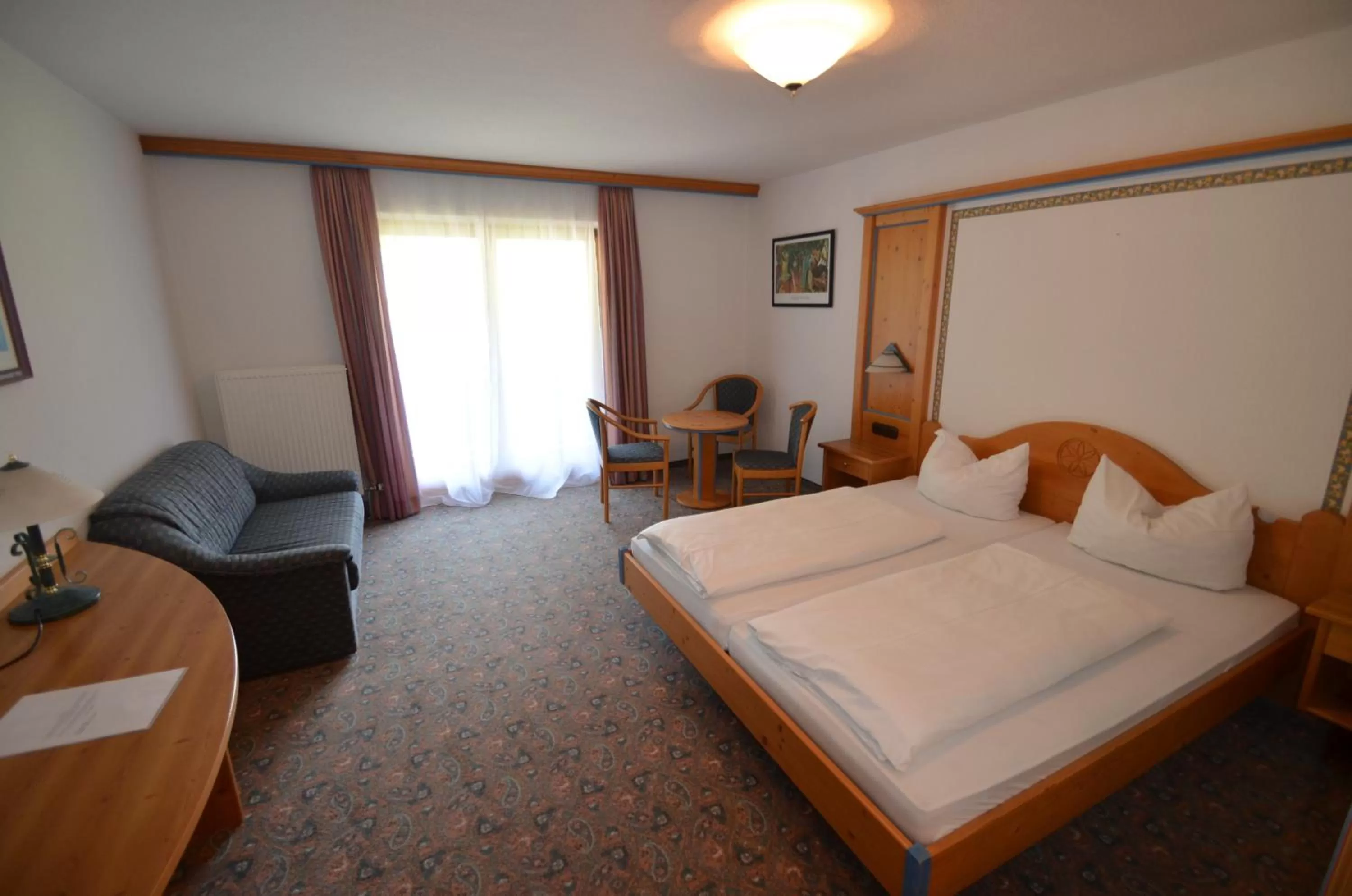 Photo of the whole room, Bed in Alpenhotel Widderstein