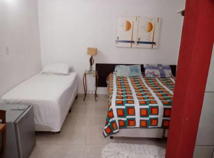 Bed in Pousada Villas