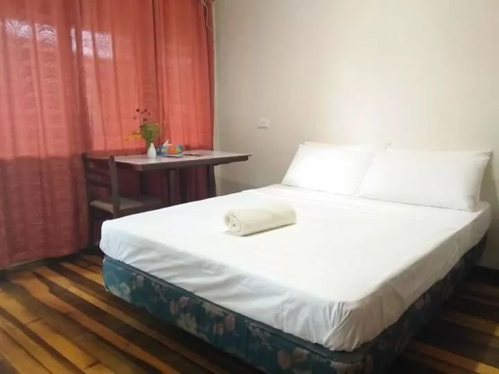 Bed in Tawali Leisure & Dive Resort