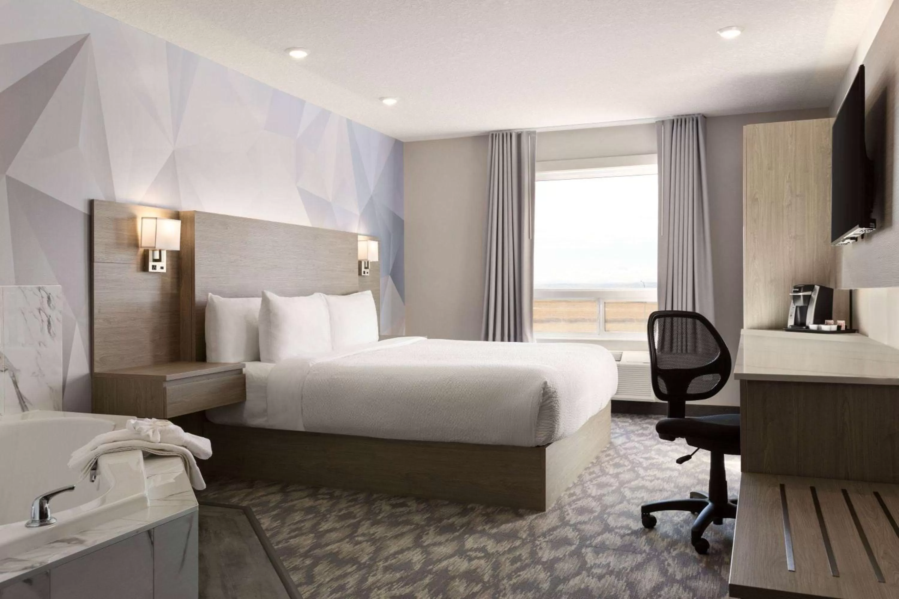 Photo of the whole room, Bed in Days Inn by Wyndham Calgary North Balzac