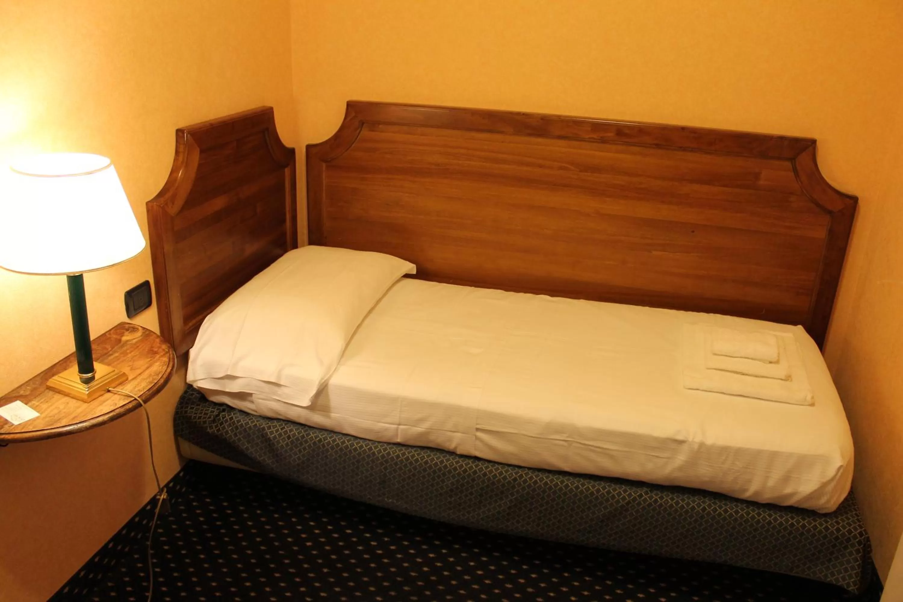 Bed in Hotel Don Carlo