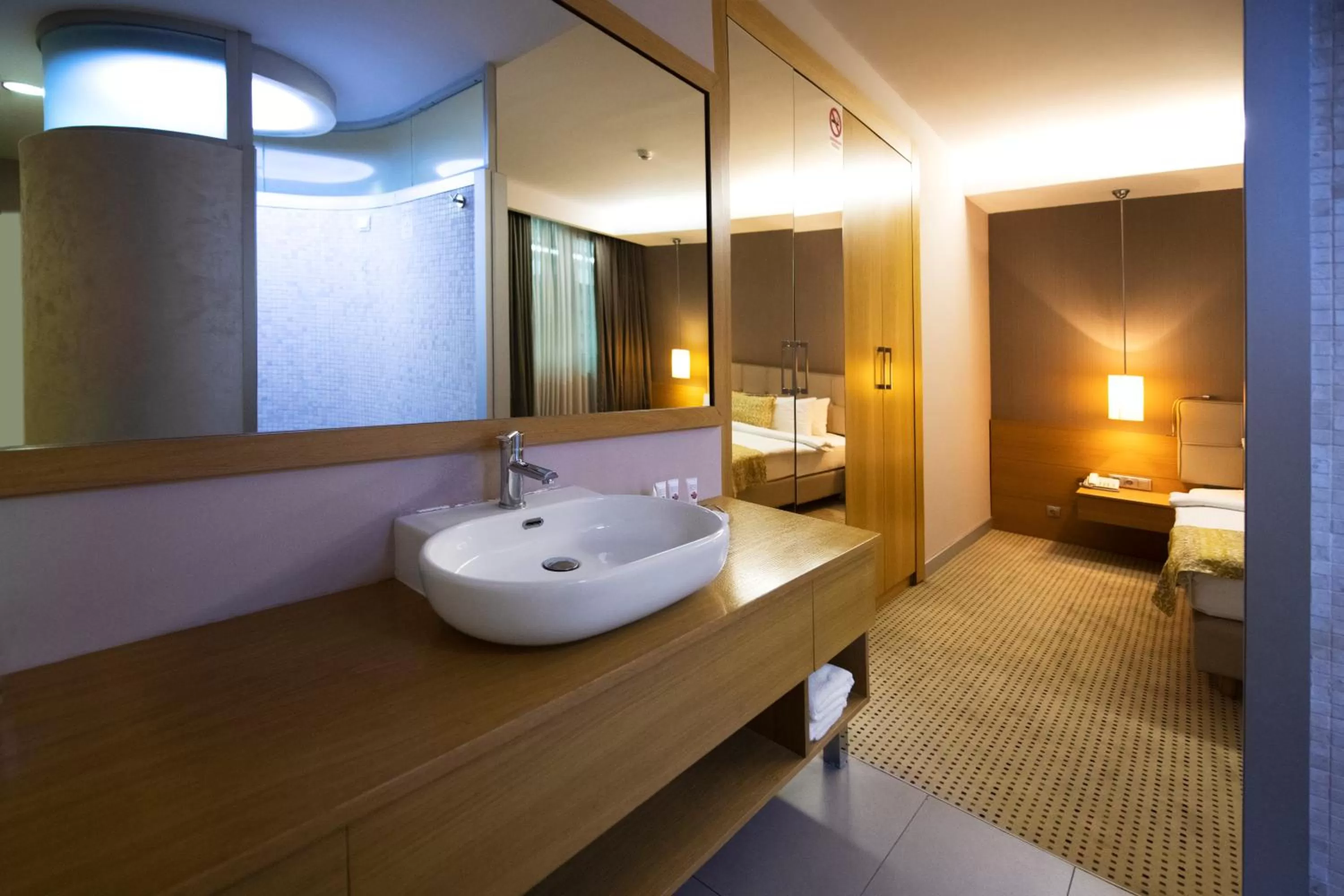 Bathroom, Bed in Ramada by Wyndham Podgorica