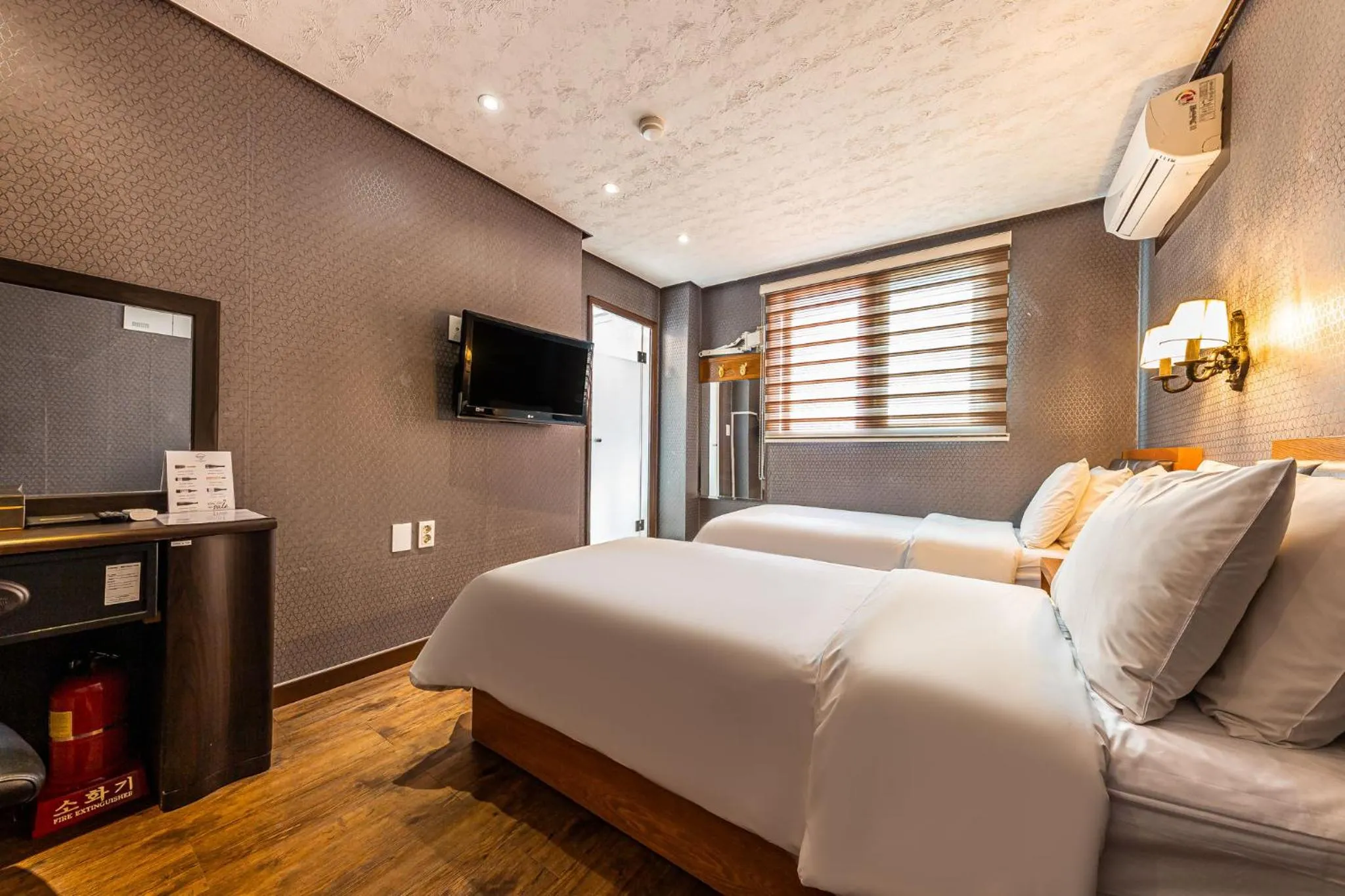 Bed in Friendly DH Naissance Hotel by Mindrum Group