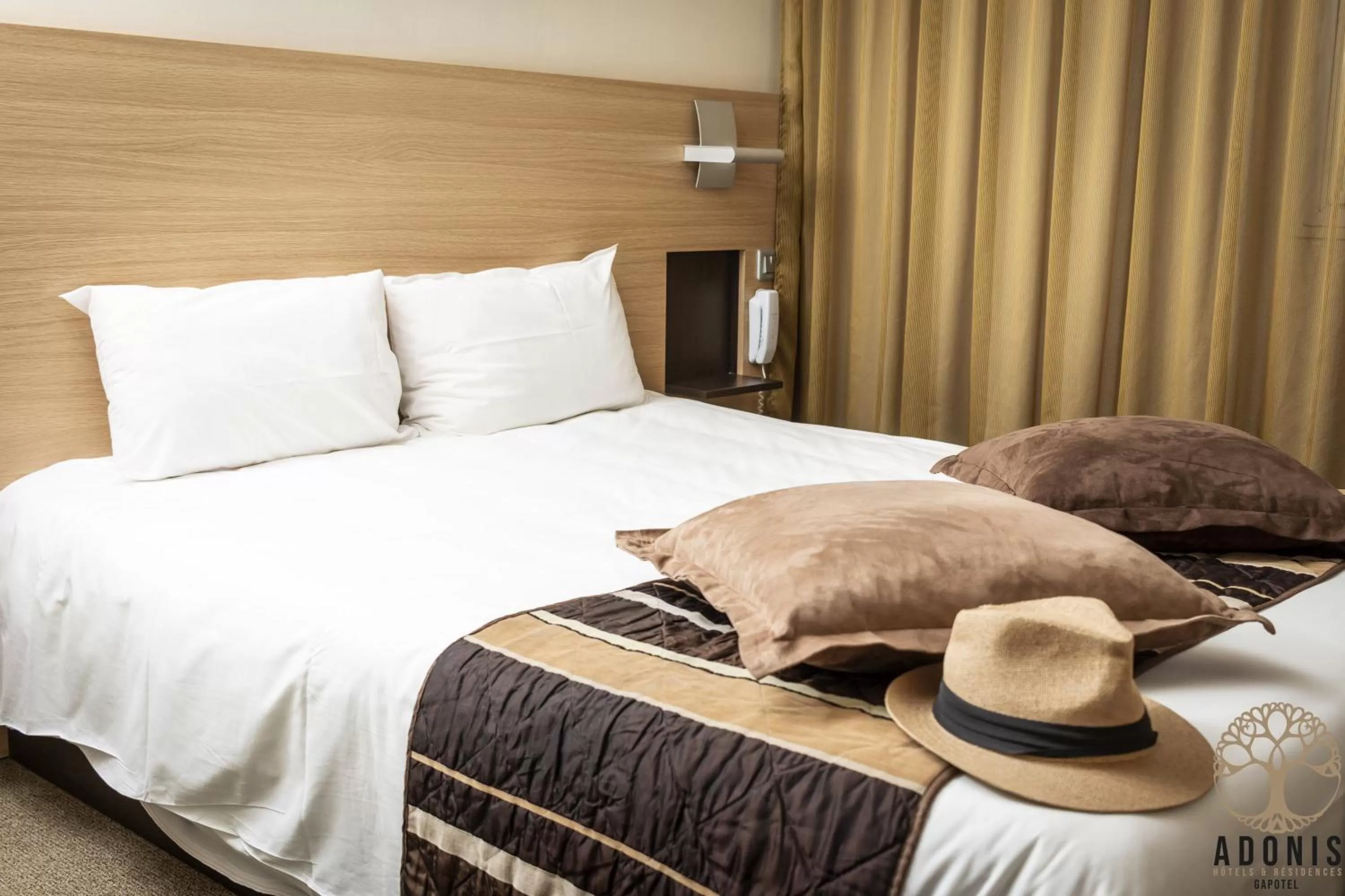 Bed in Adonis Gapotel