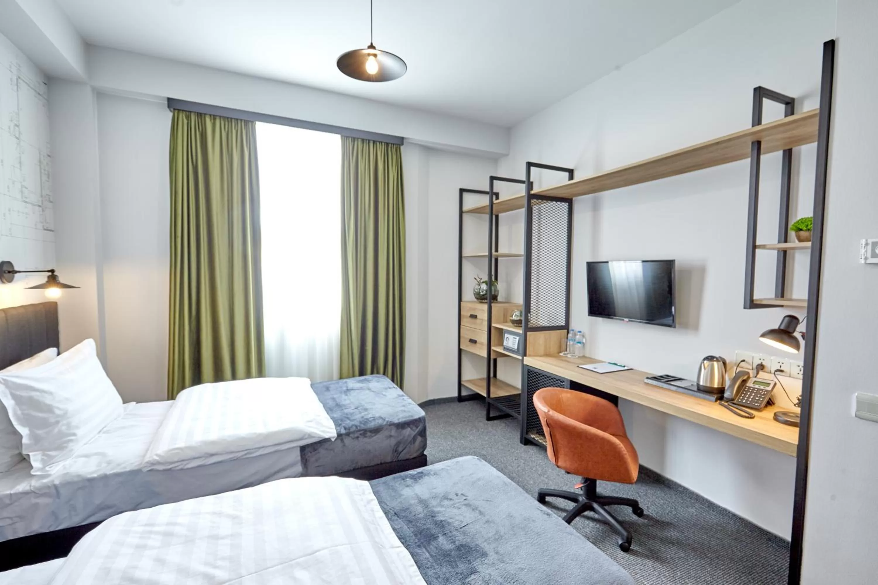 Bed in Graphica Tbilisi Hotel