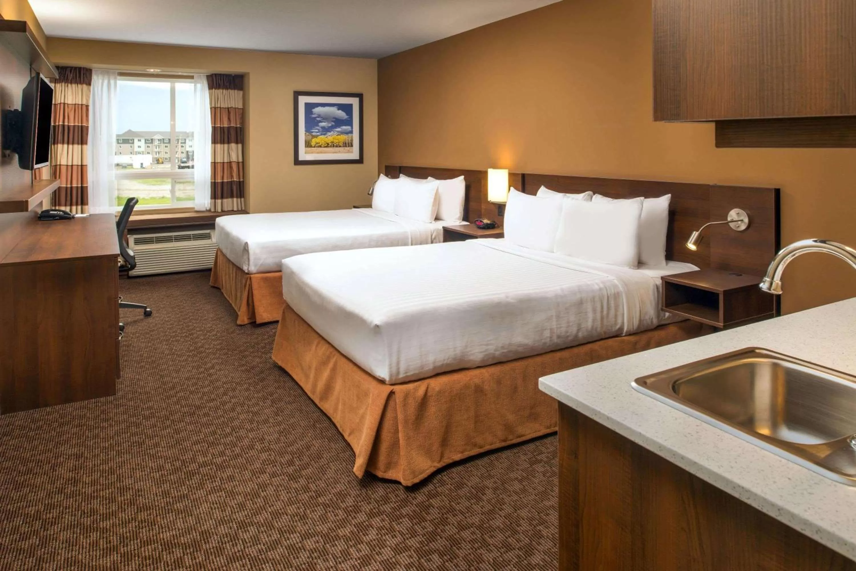 Business Queen Room with Two Queen Beds - Non-Smoking in Microtel Inn & Suites by Wyndham Red Deer