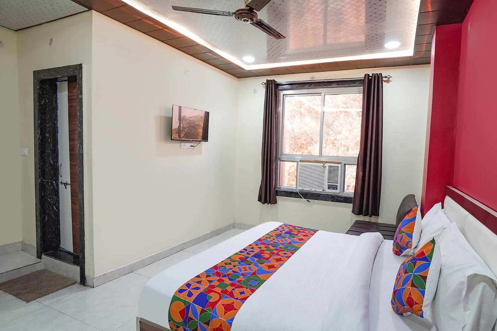 Bed in FabHotel Rajdhani