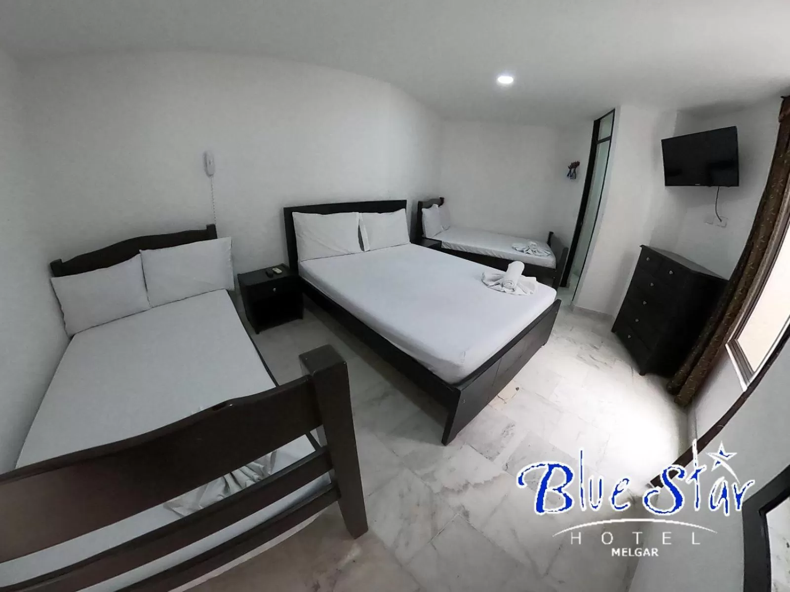 Bed in Blue Star Hotel