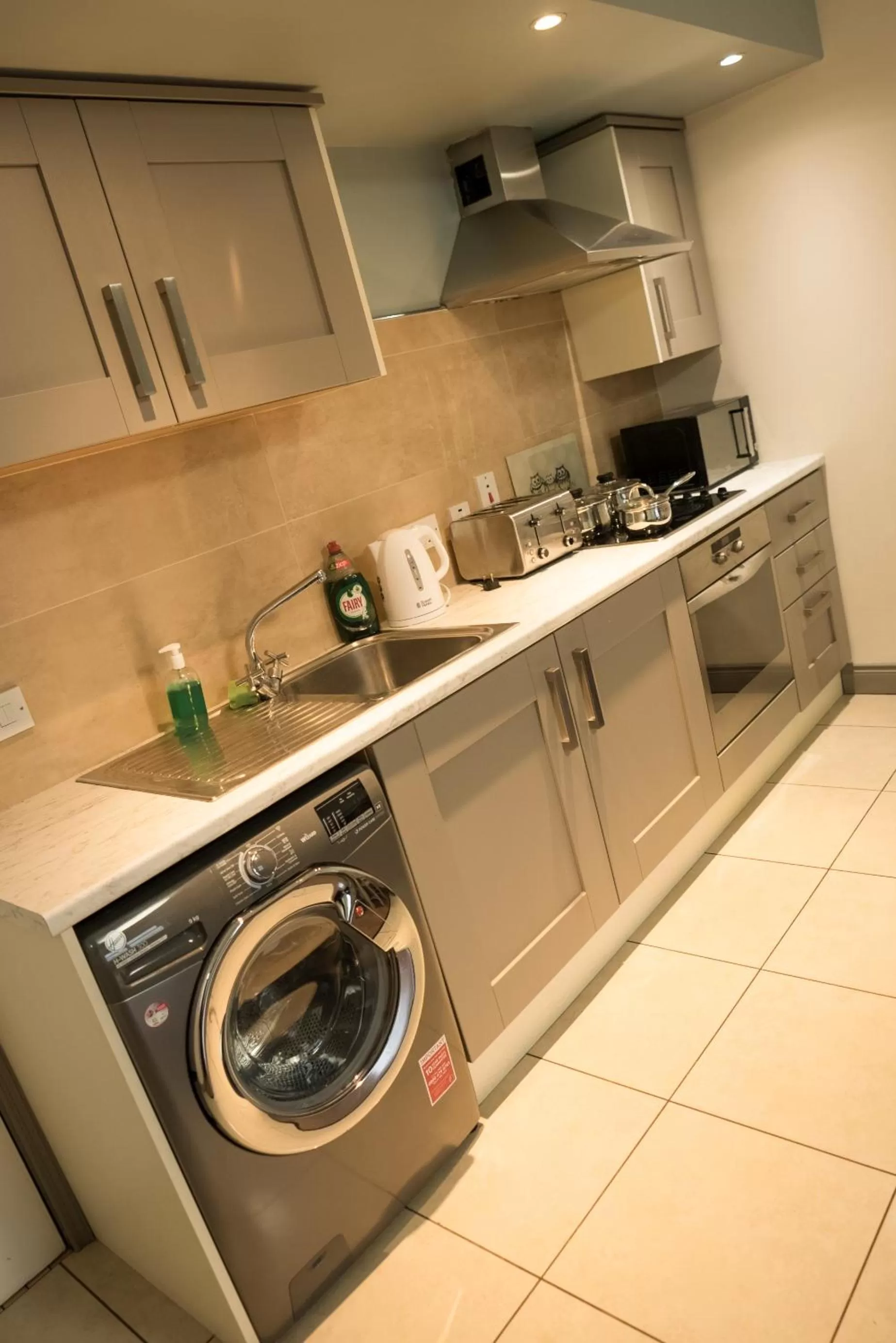 Kitchen or kitchenette in Walsh's Hotel and Apartments