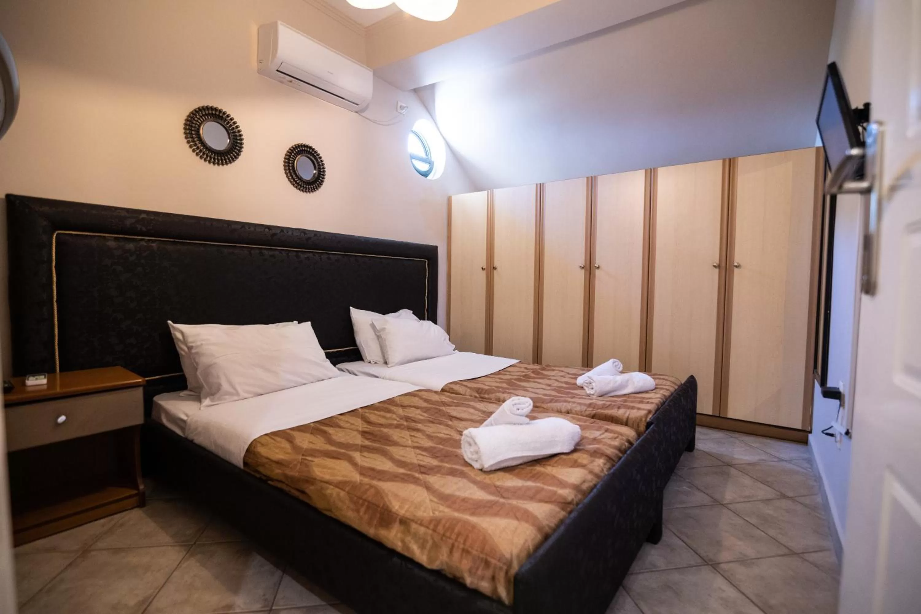 Bed in Votsalakia Hotel & Luxury Apartments