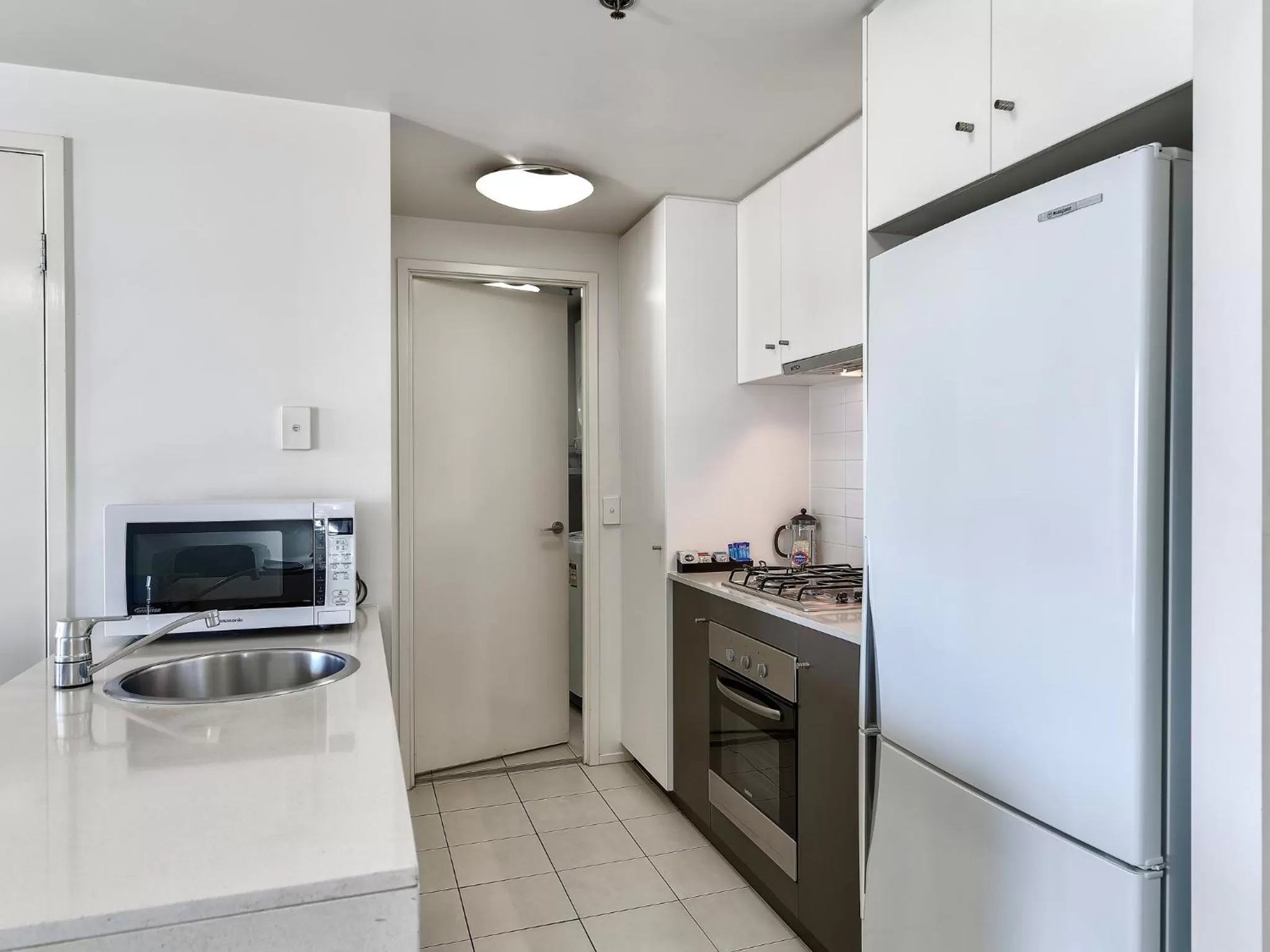 Kitchen or kitchenette in SKD Suites
