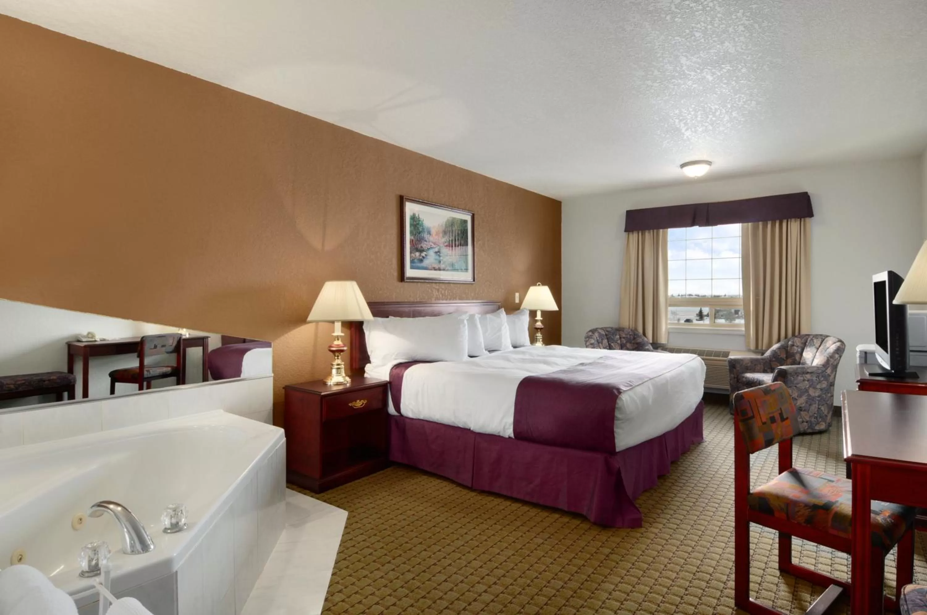 Bed in Ramada by Wyndham Red Deer Hotel & Suites