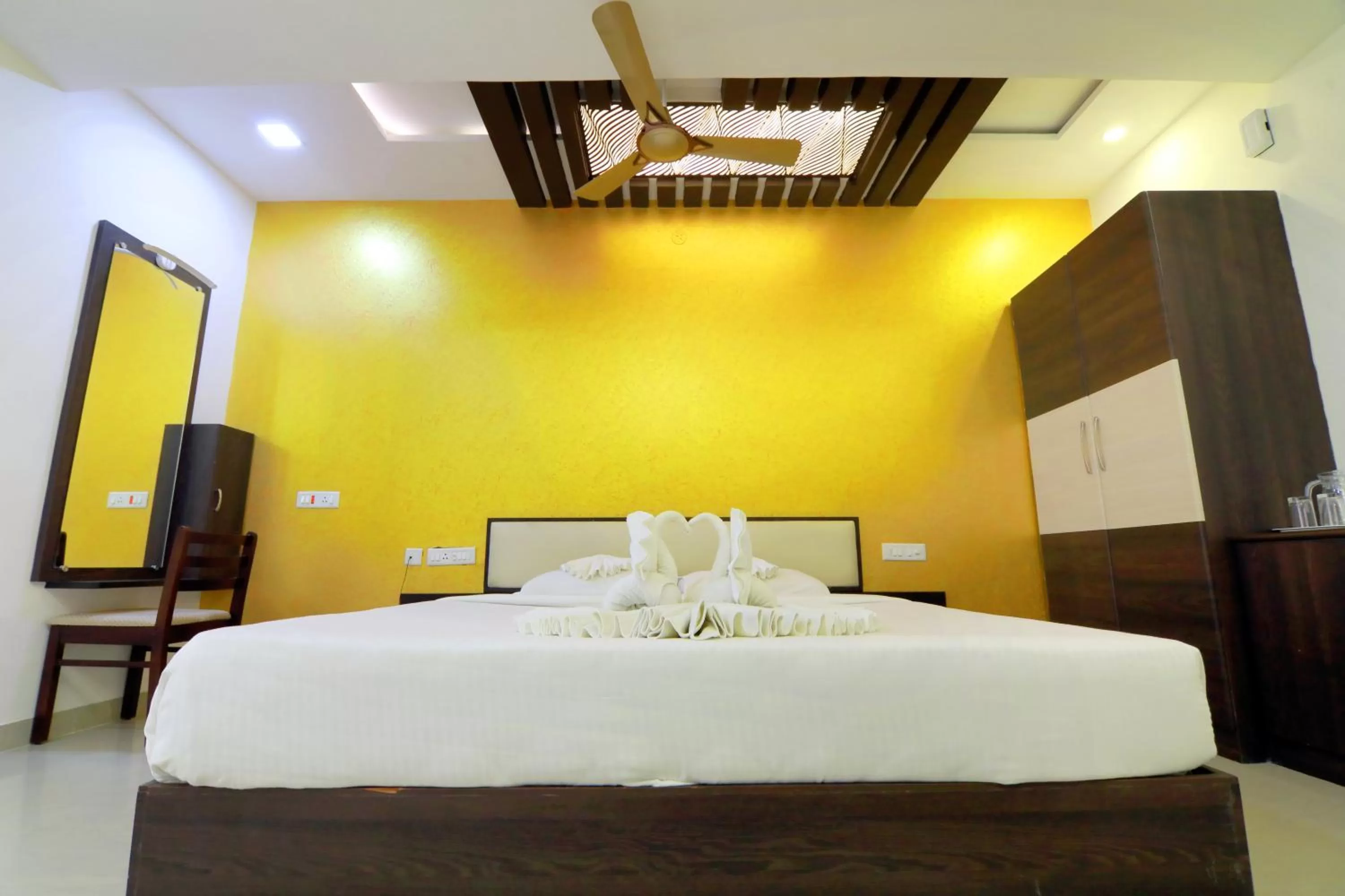 Bed in Hotel Ambai Grand