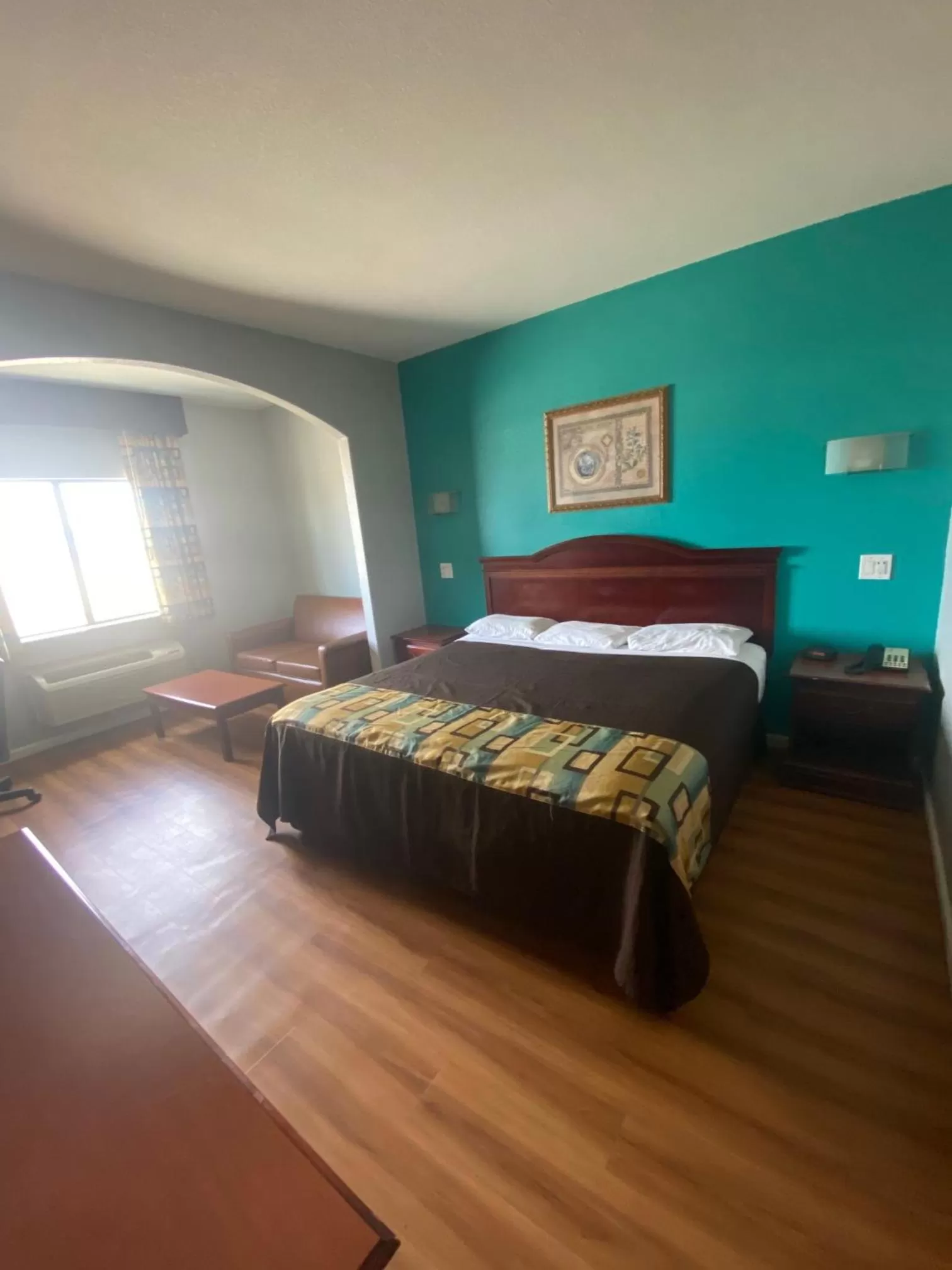 Bed in Tropicana Inn and Suites