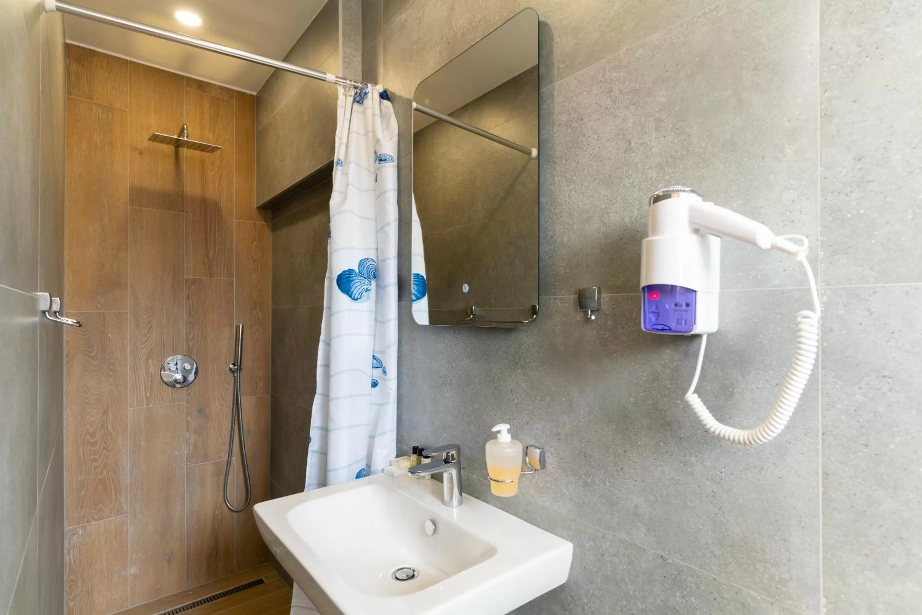 Bathroom in Ornament Hotel and Apartments