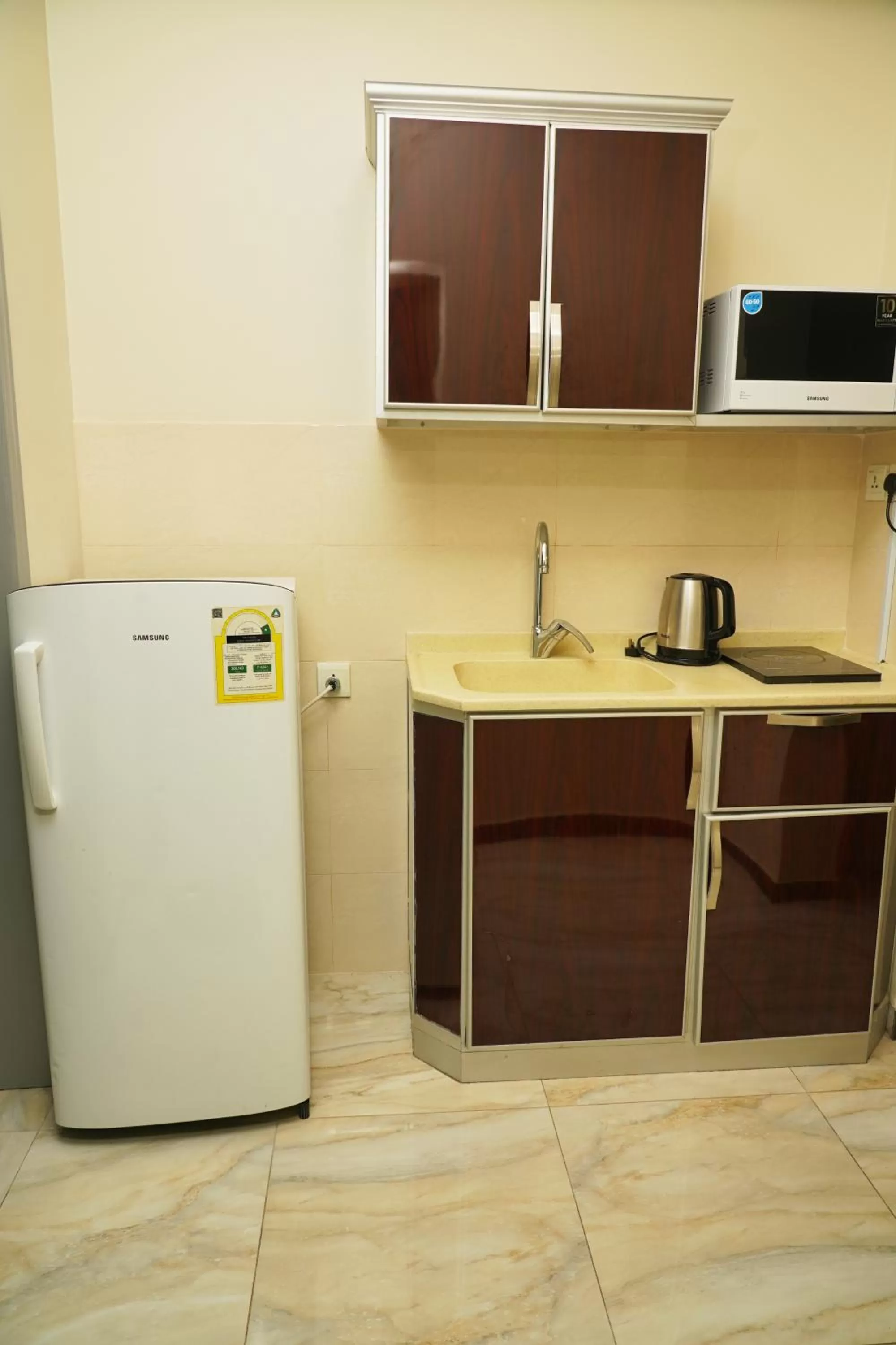 Kitchen or kitchenette in Wahaj Al Mesak Units