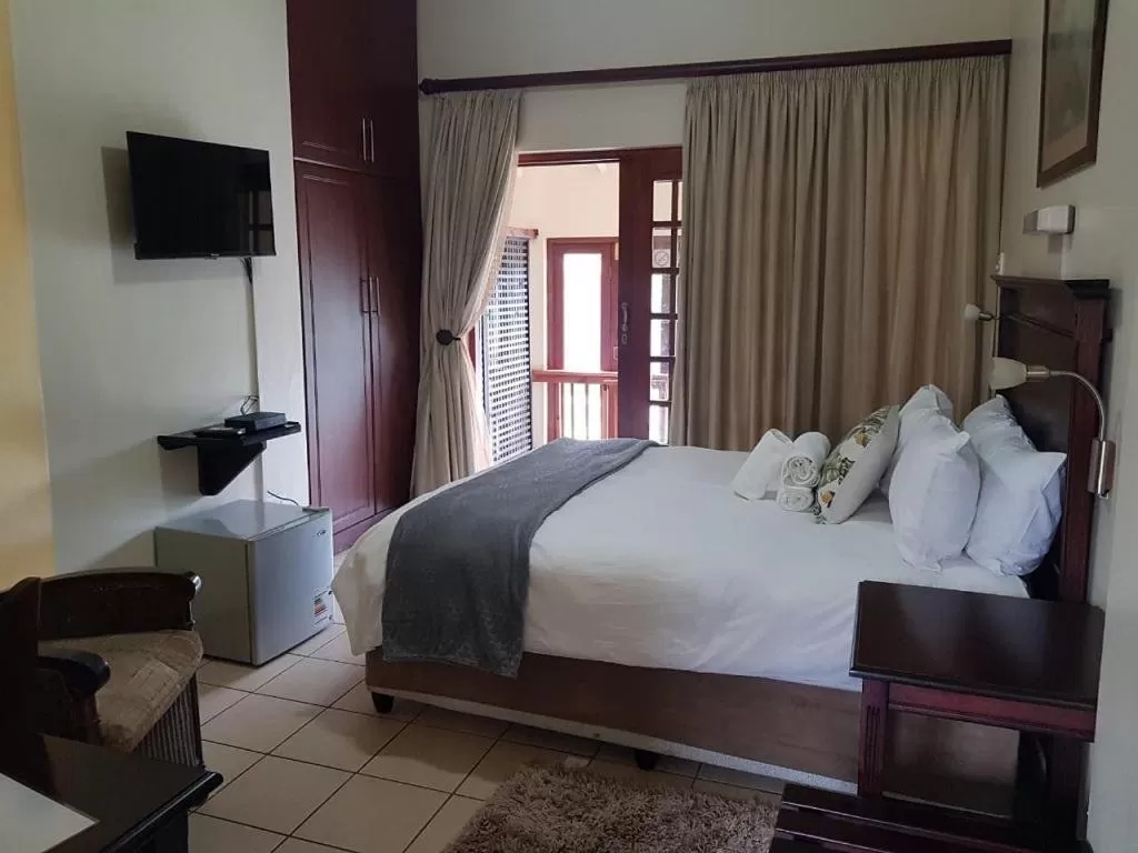 Bed in Mzingeli Guesthouse