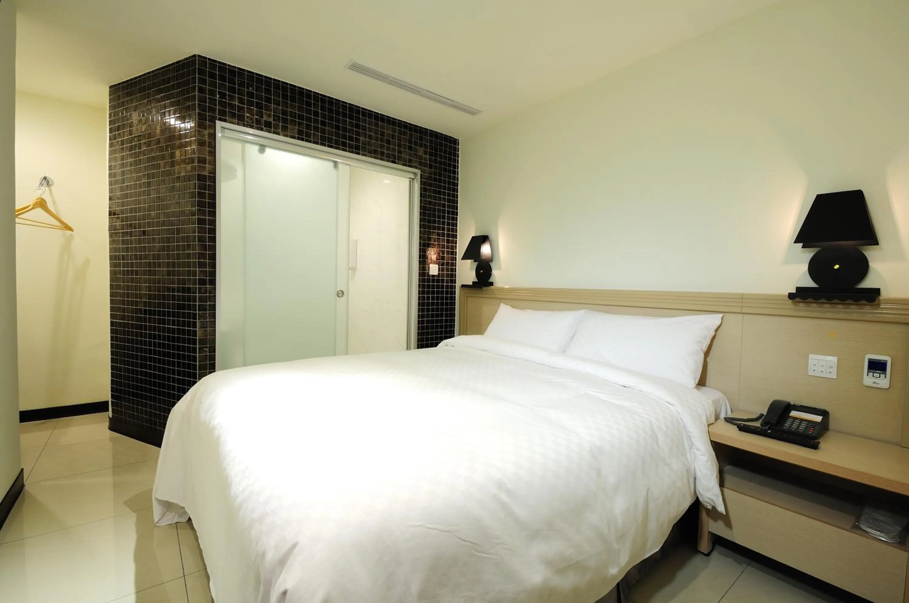 Bed in 安可旅店 Bravo Hotel