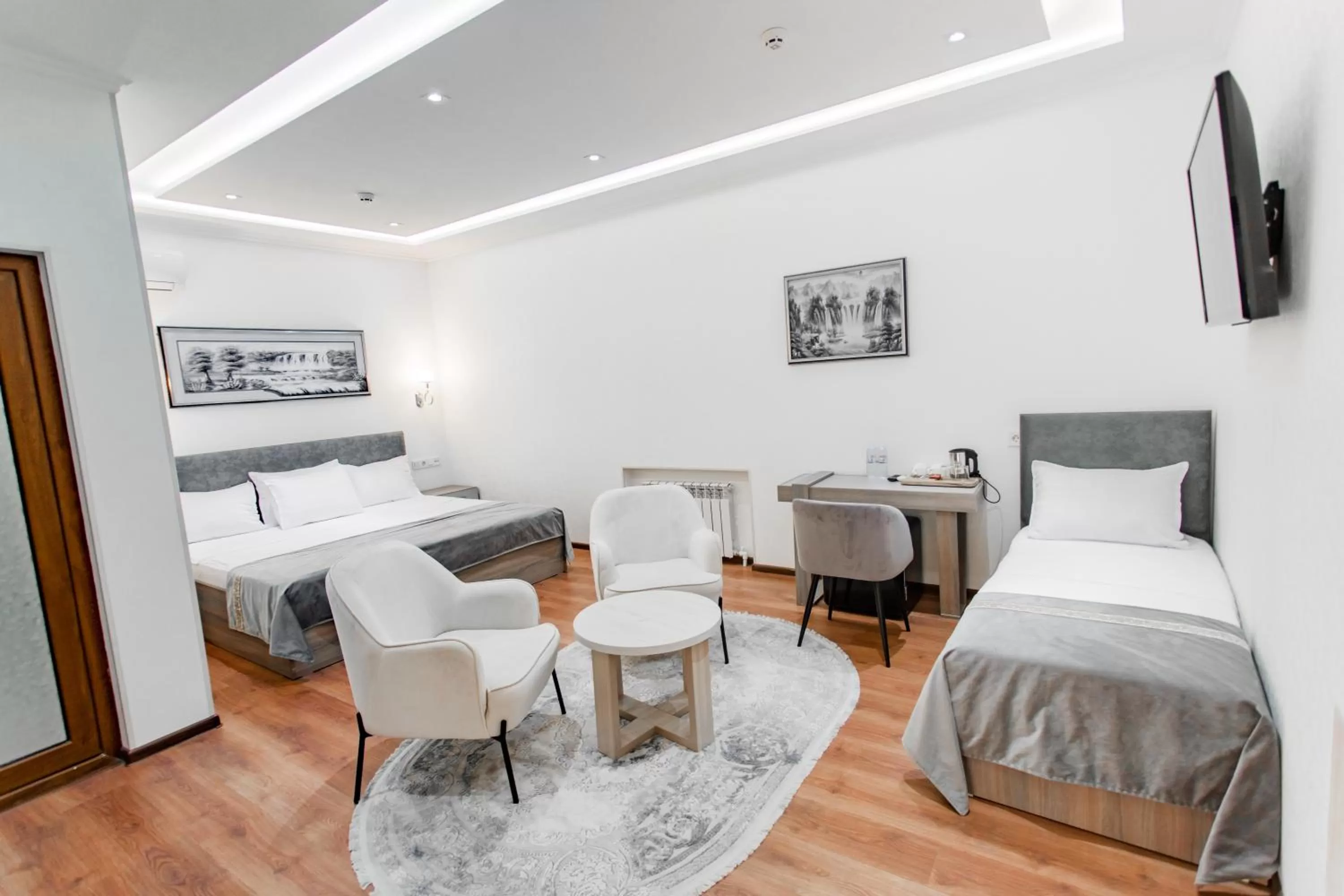 Living room, Bed in Registon Saroy Hotel