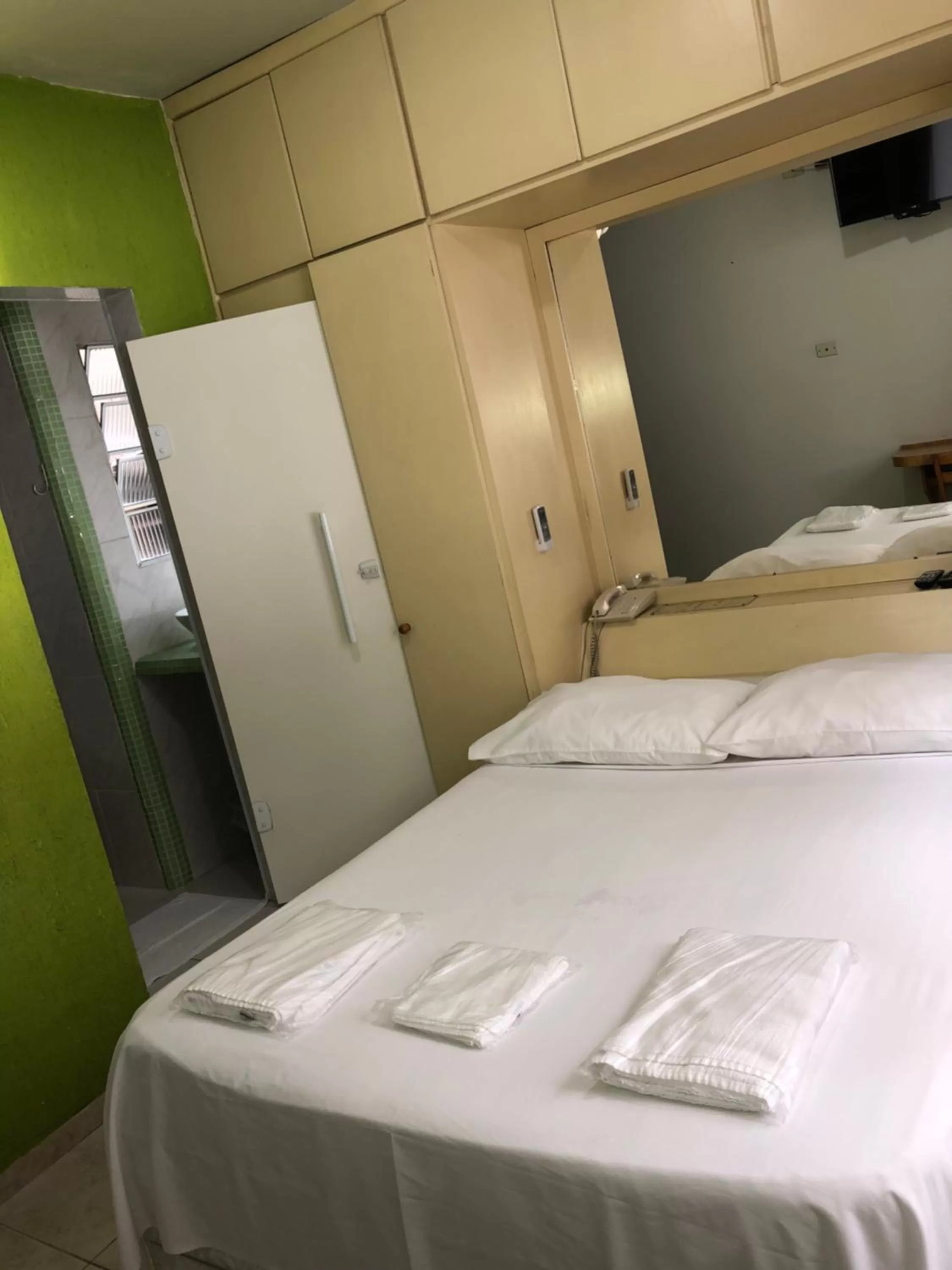 Bed in Center Plaza Hotel