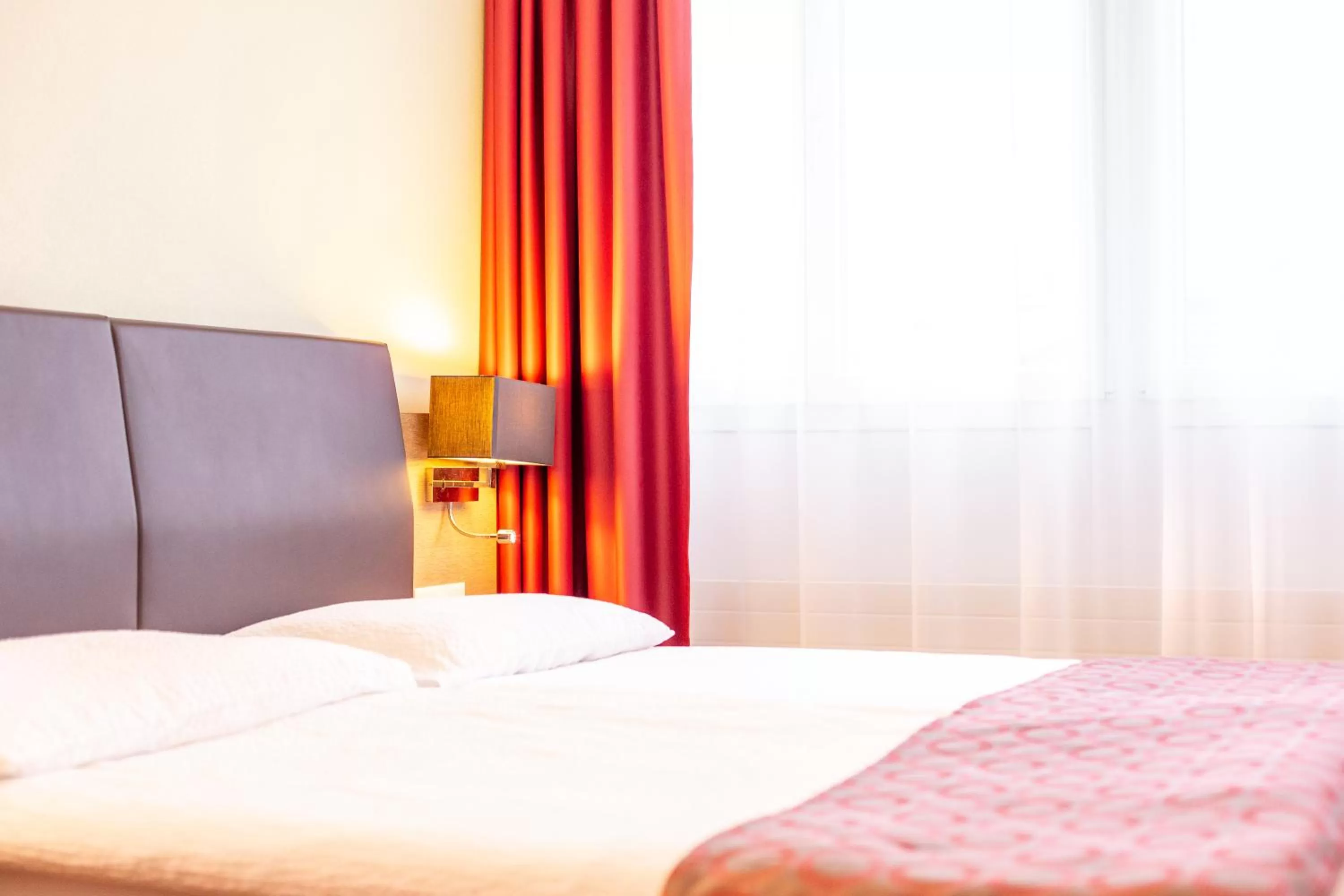 Bed in Hotel Alexander