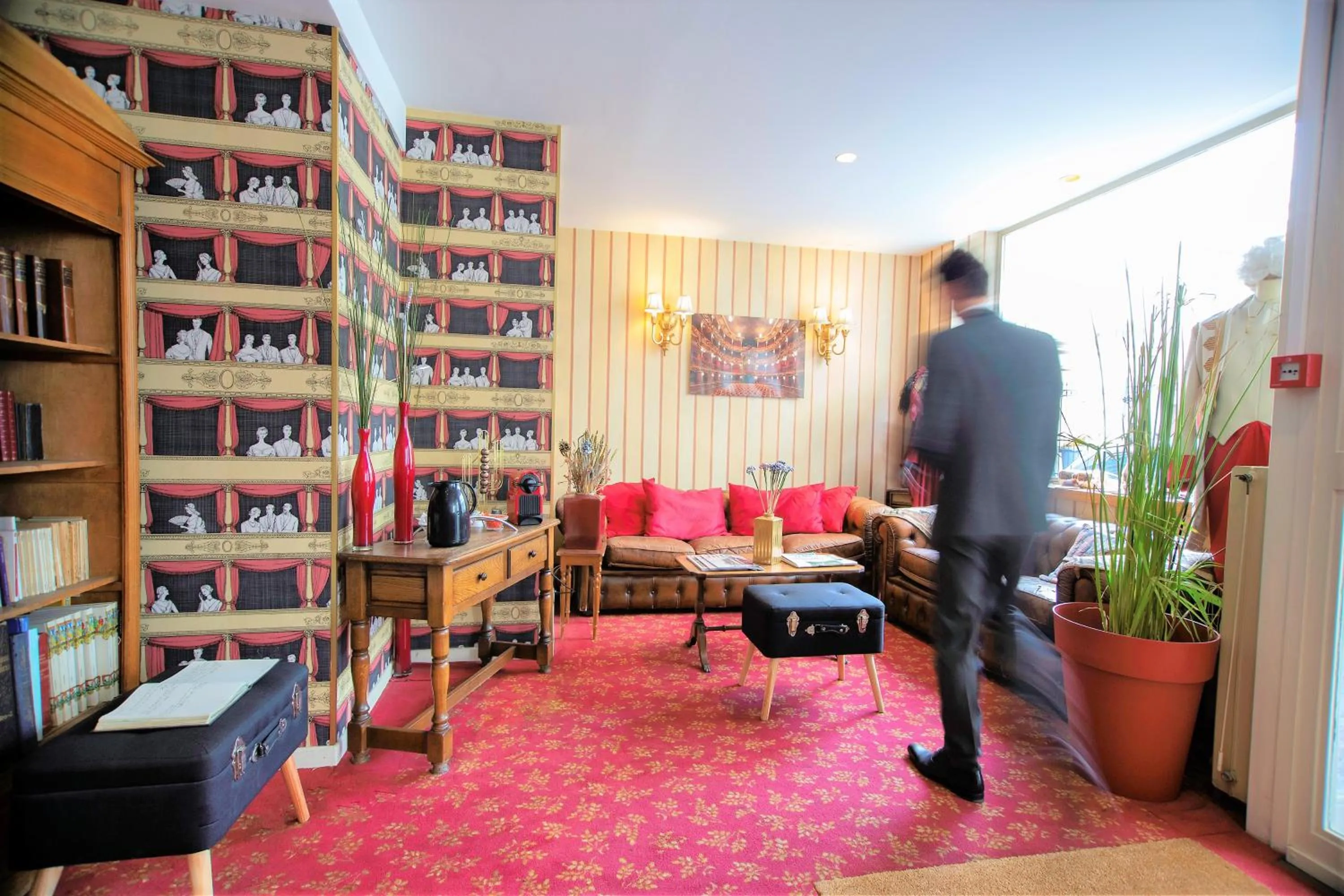 Communal lounge/ TV room in Hôtel du Théâtre by Patrick Hayat