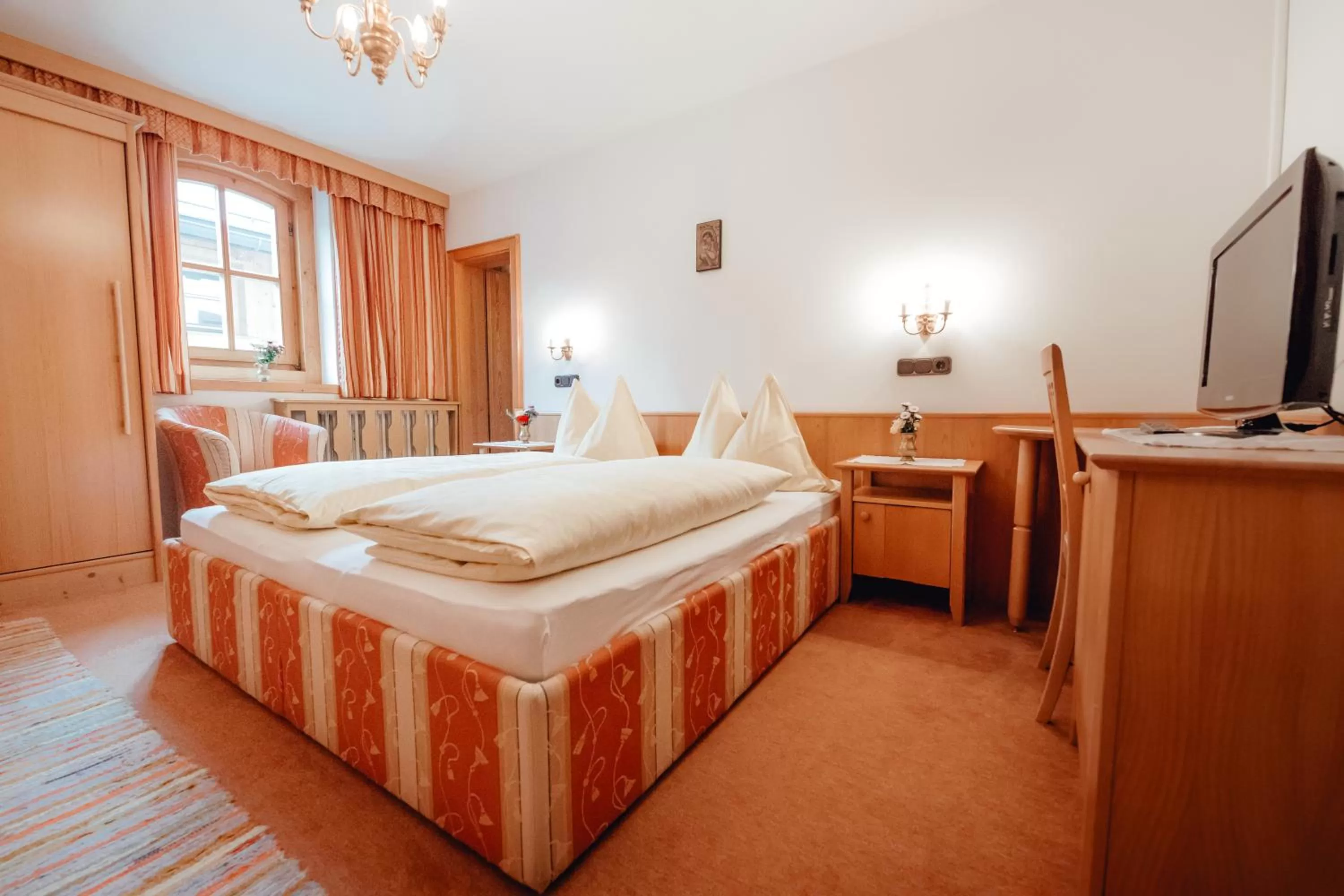 Bed in Zimmer & Ferienwohnungen Dandler