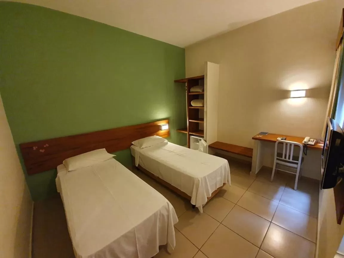 Bed in Meu Hotel Garça