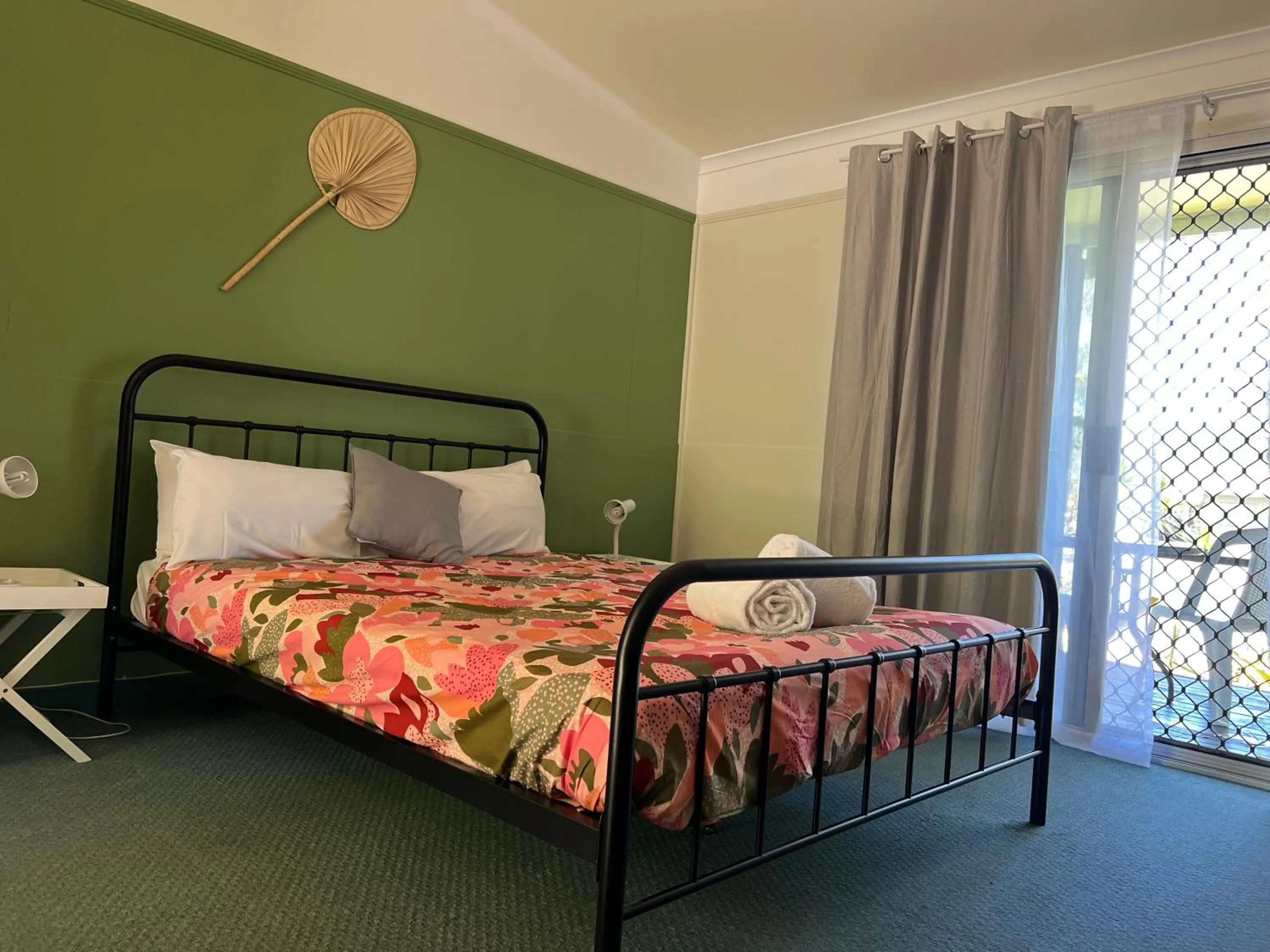 Bed in Colonial Village Resort