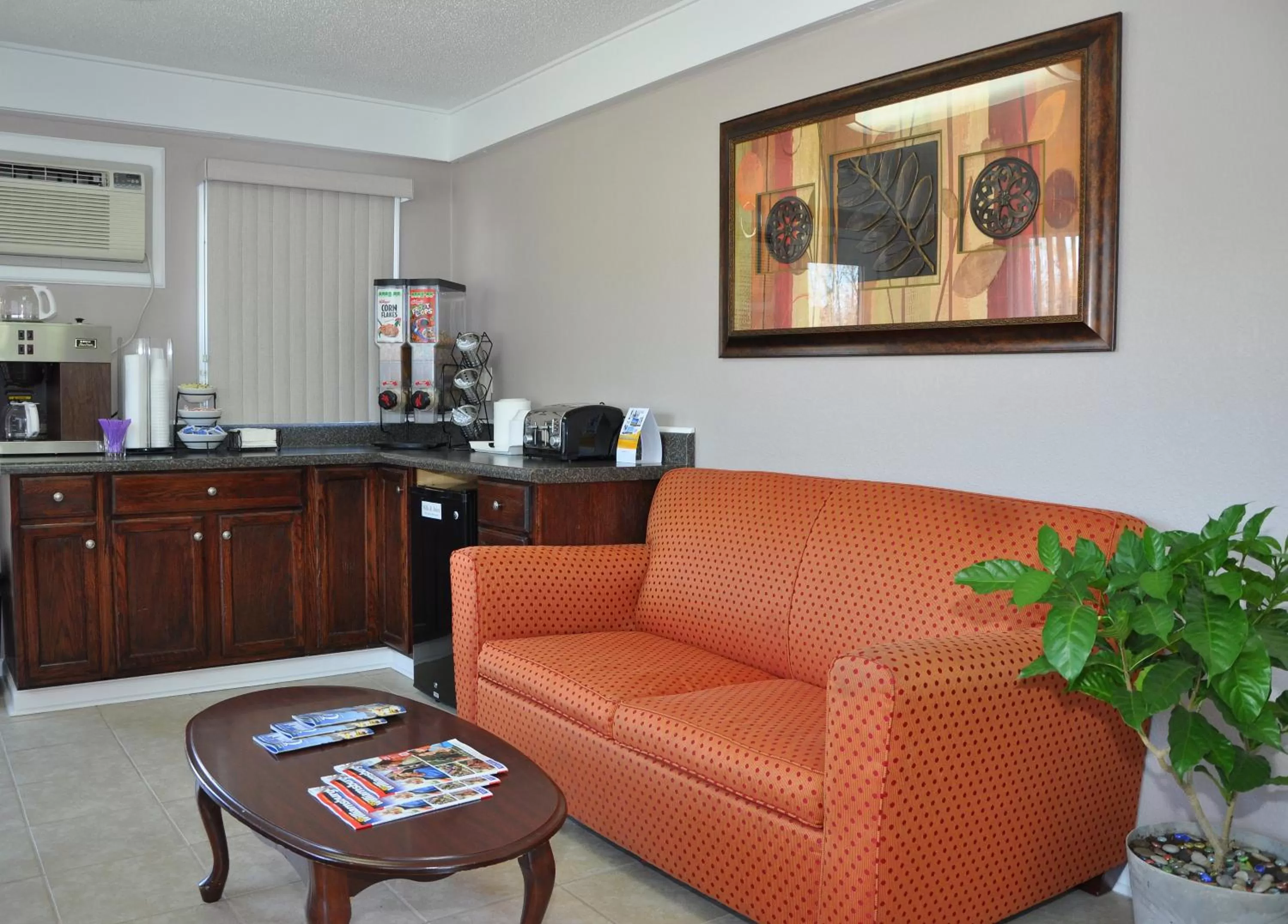 Lobby or reception in MERRIMAC INN & SUITES