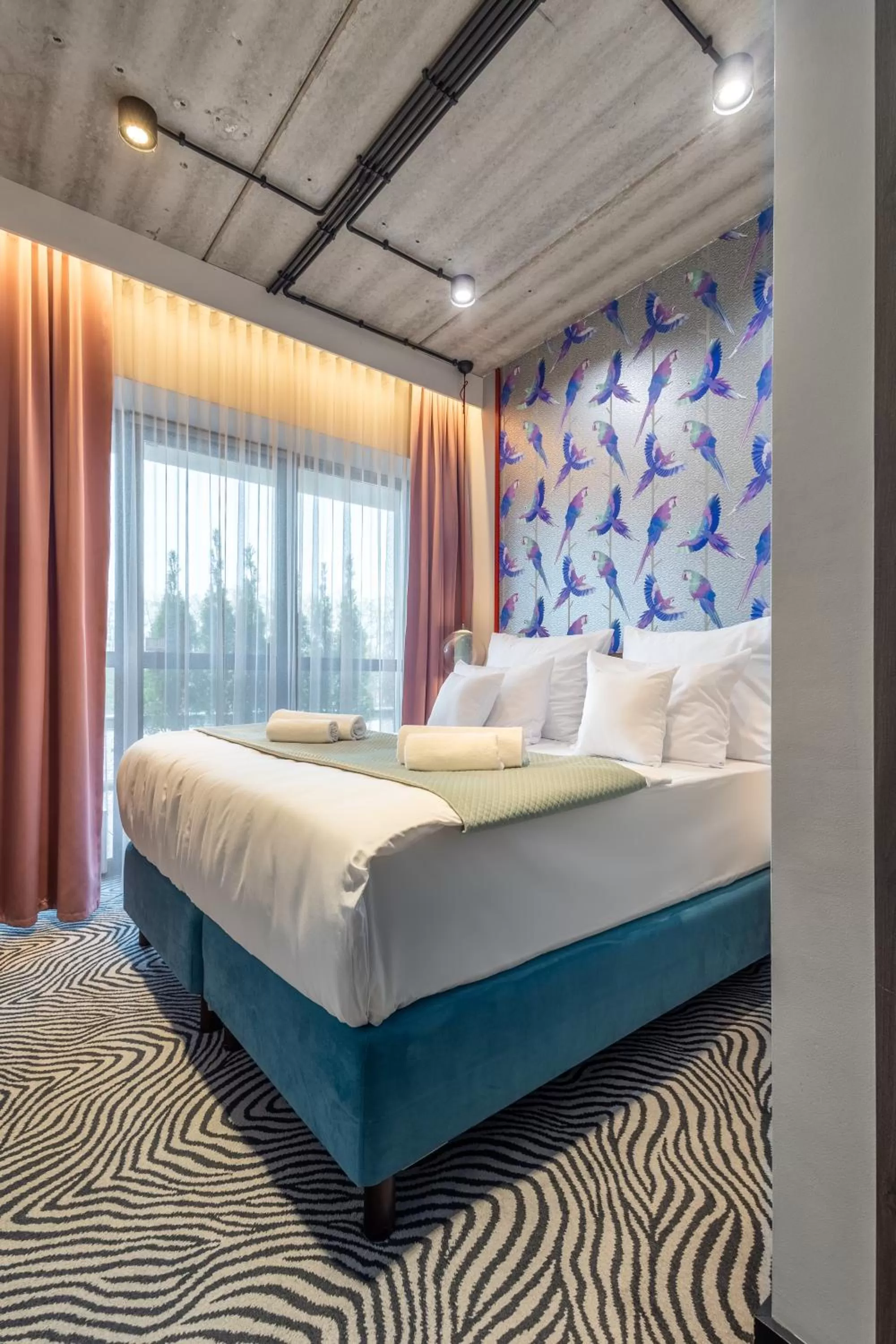 Bed in Hotel Zoo by Afrykarium Wroclaw