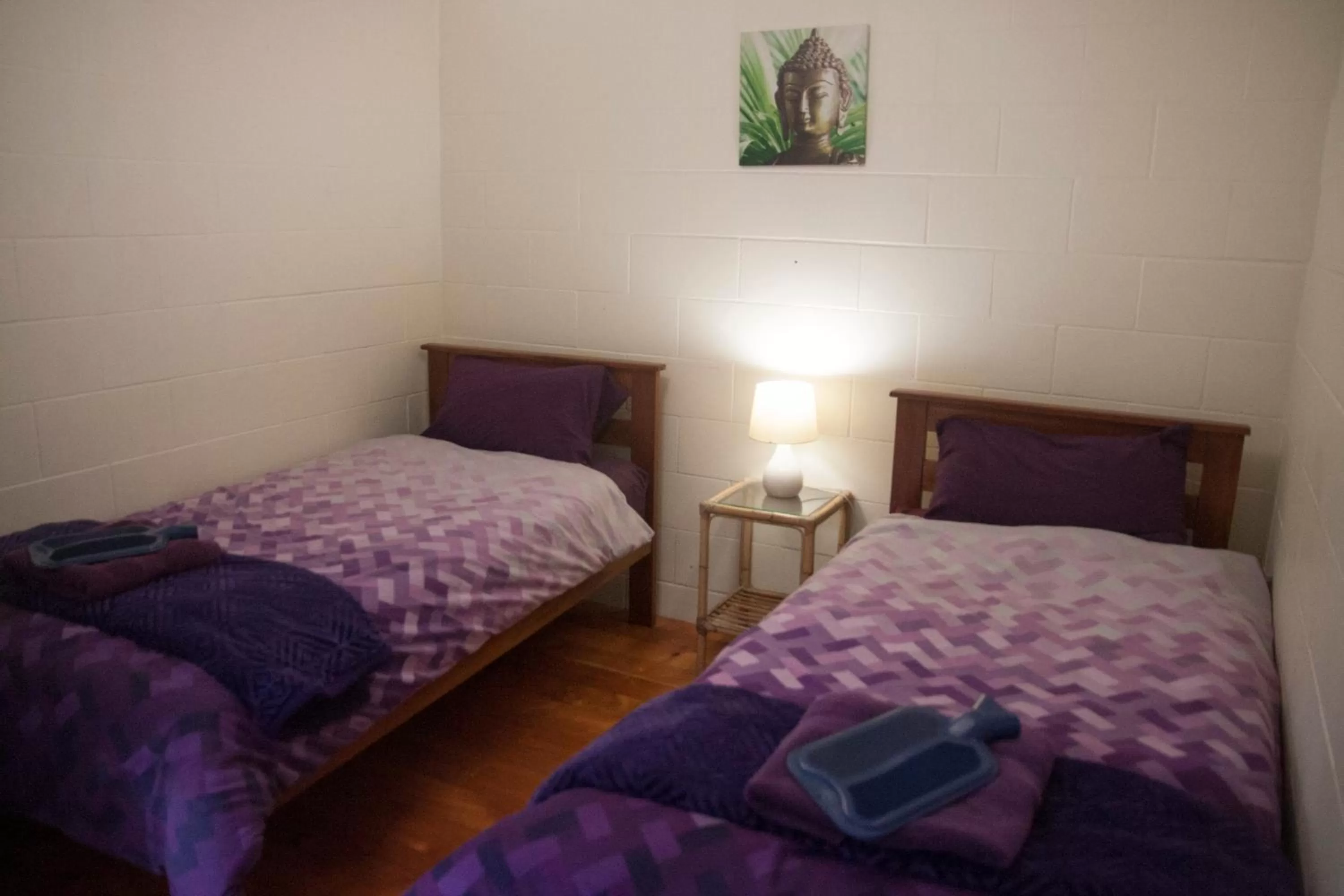 Bed in Kawai Purapura Yoga Retreat Centre