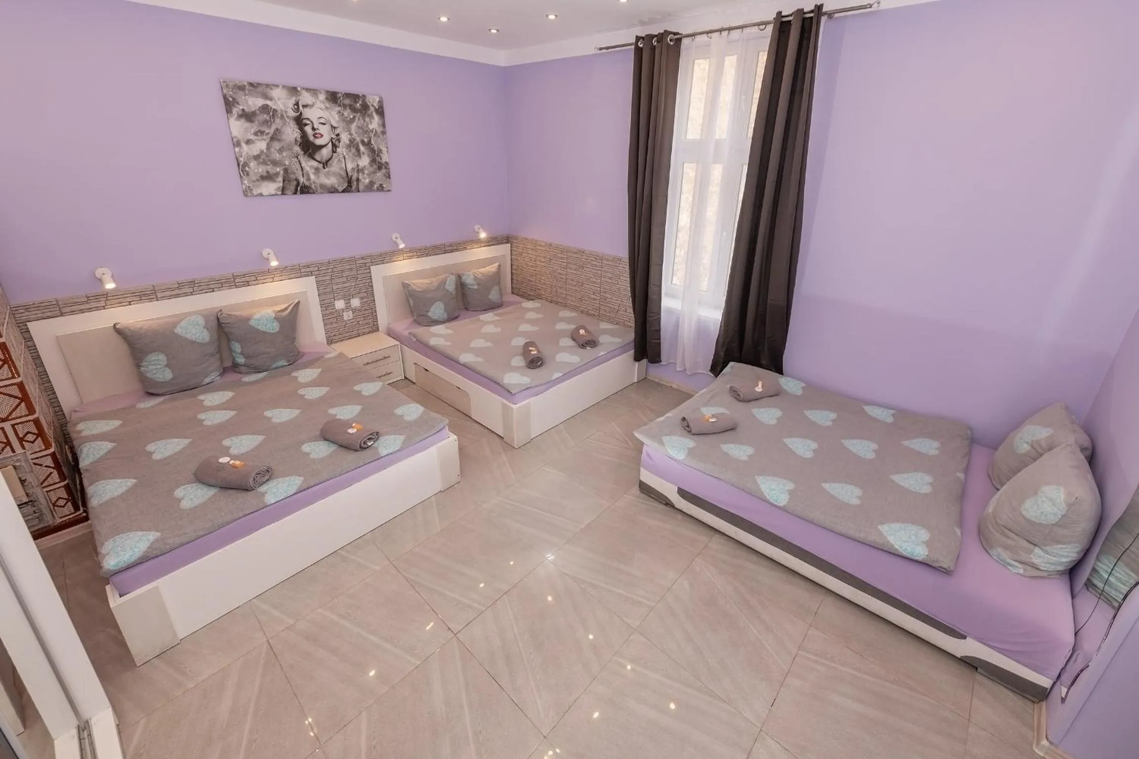 Bed in Queen Apartments