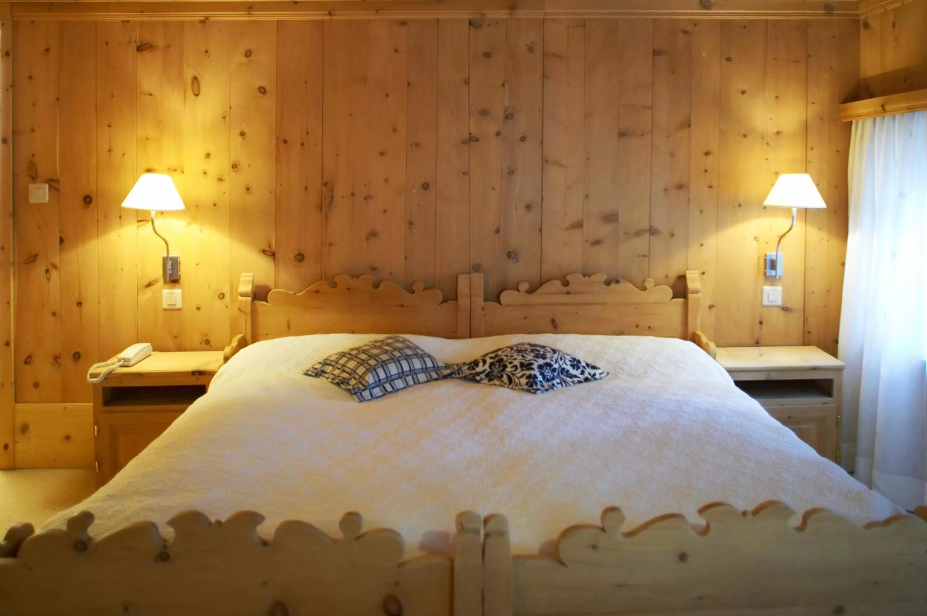 Bed in Hotel Engiadina