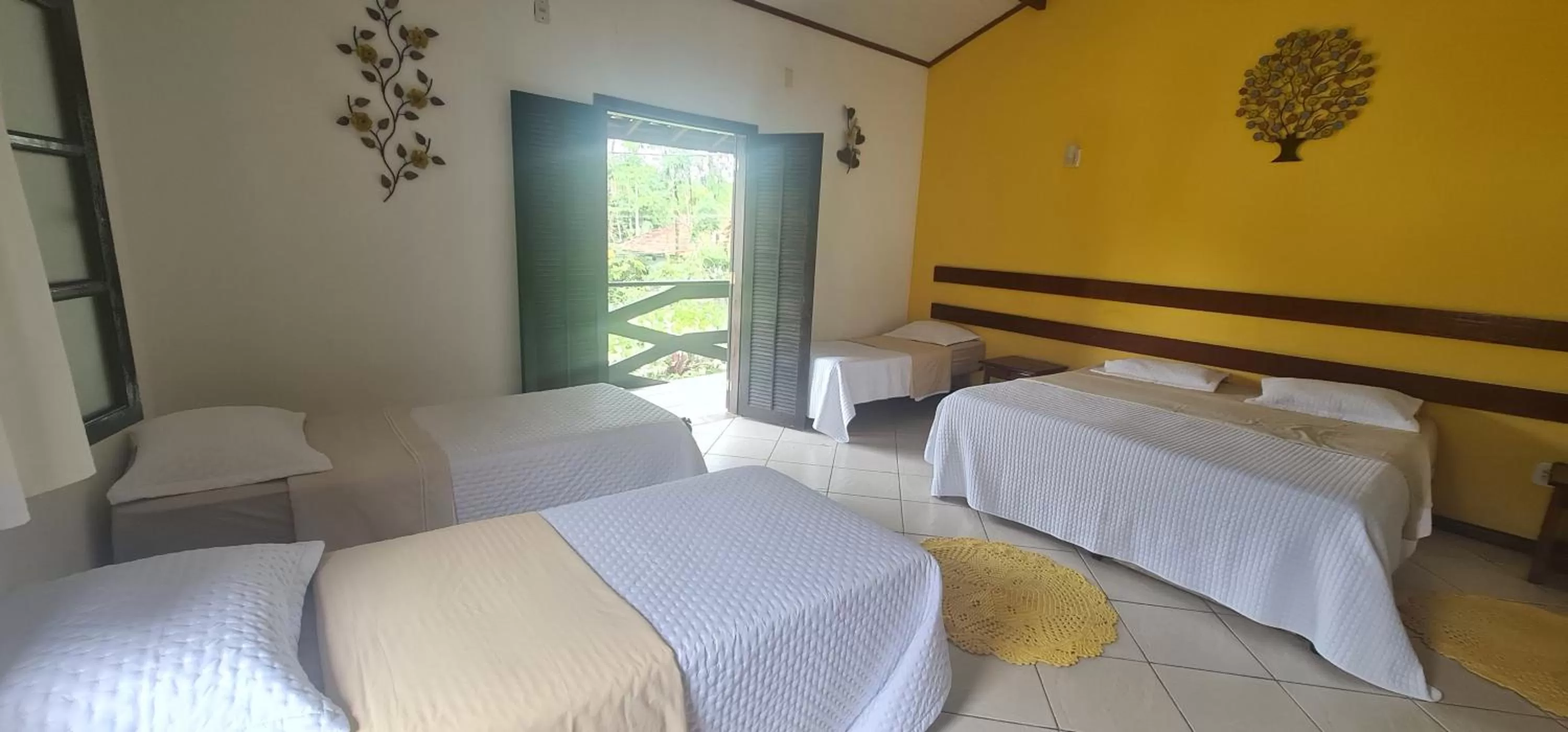 Bed in Pousada Flor de Paraty