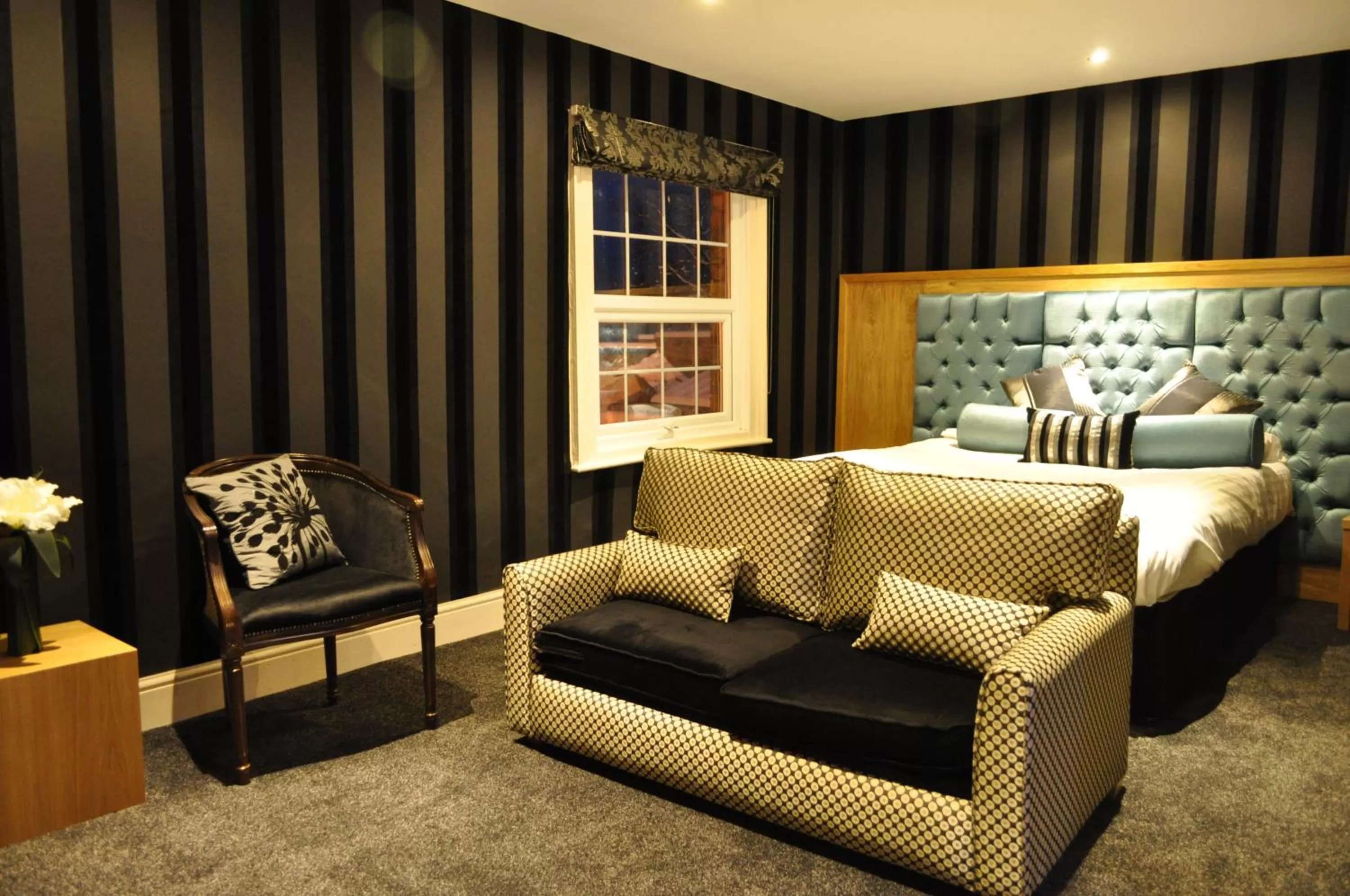 Seating area, Bed in The Angel Inn Hotel