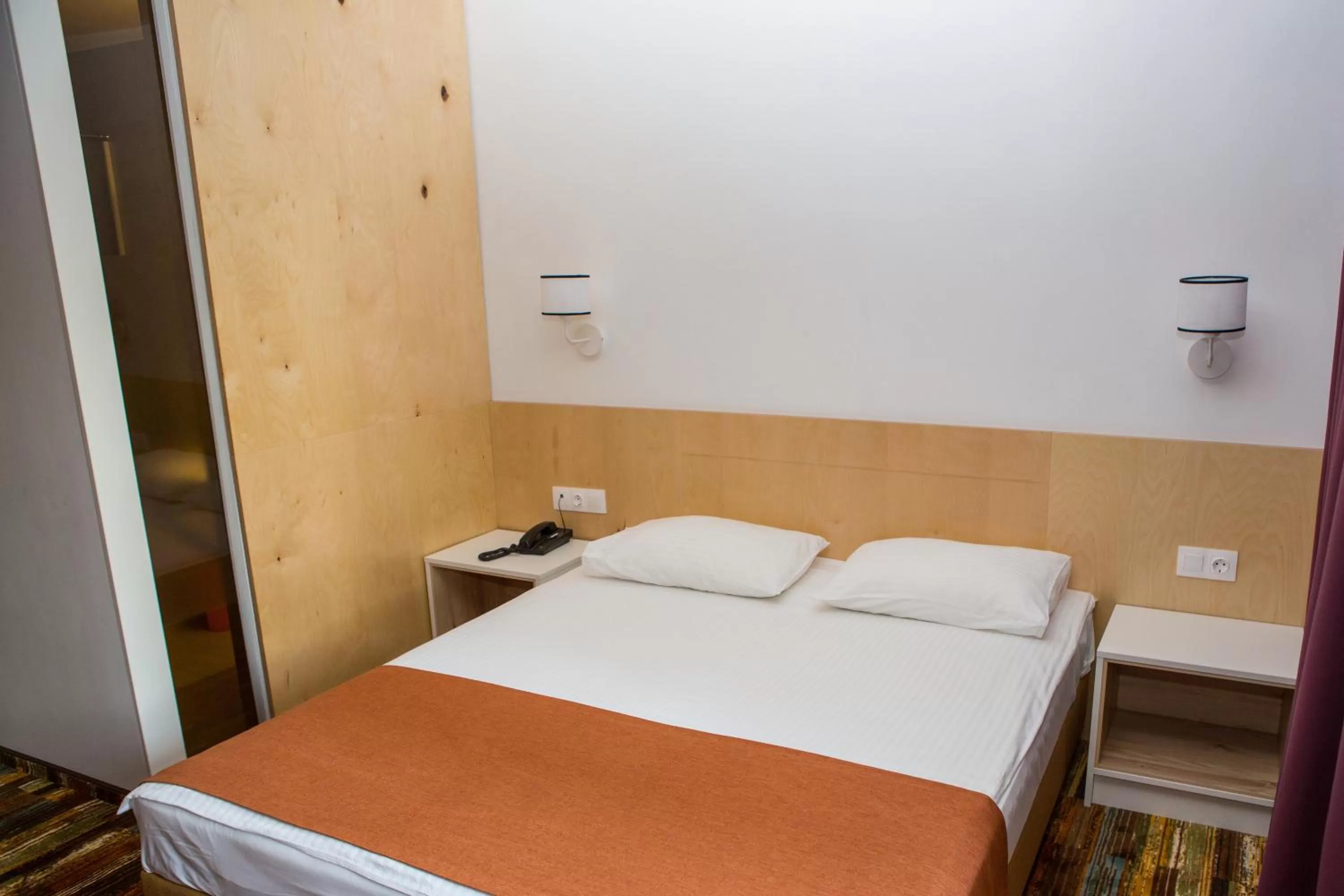 Bed in Ukraina Hotel