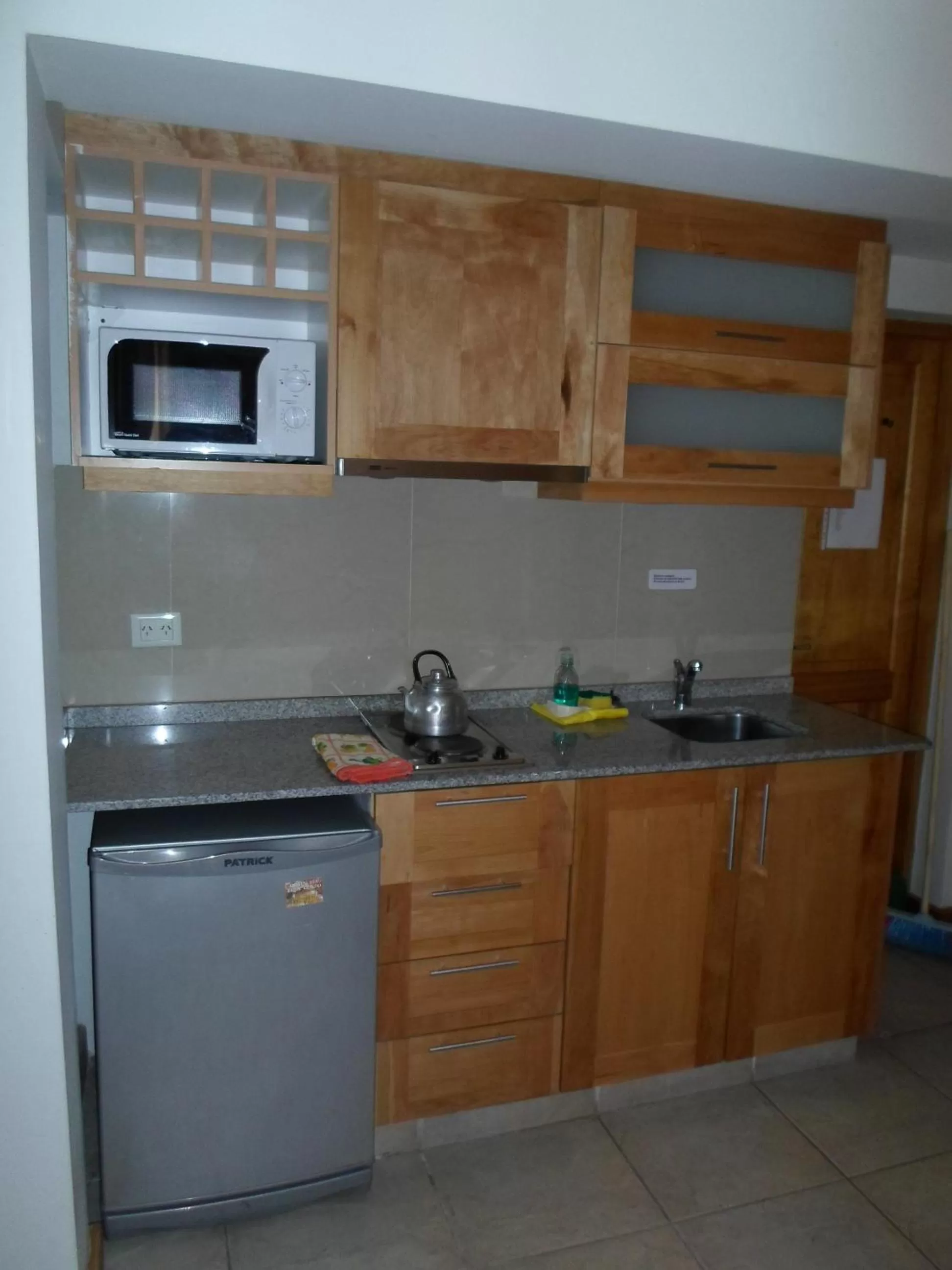 Kitchen or kitchenette in Apart Hotel Robles del Sur