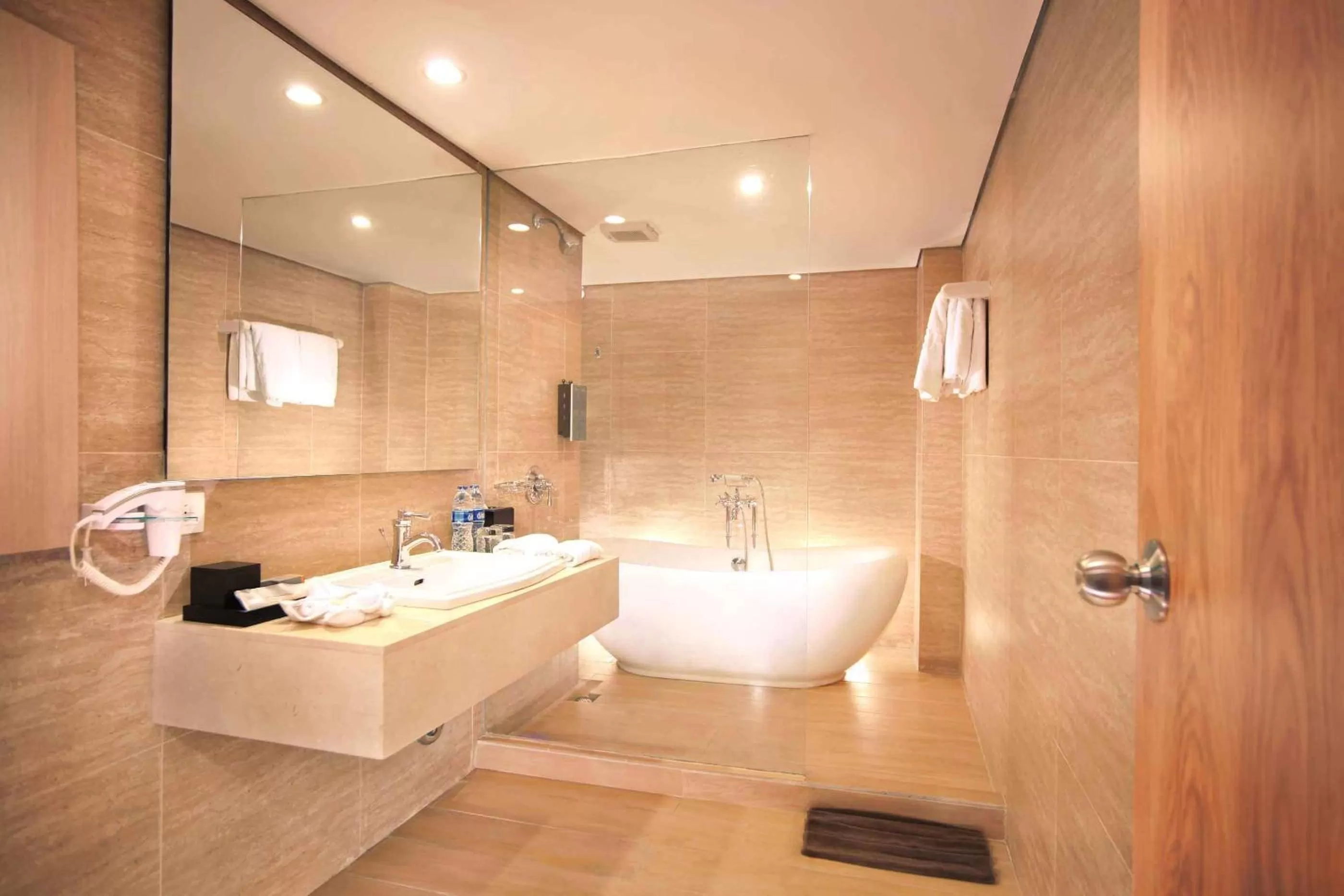 Bathroom in Harper Kuta Hotel by ASTON