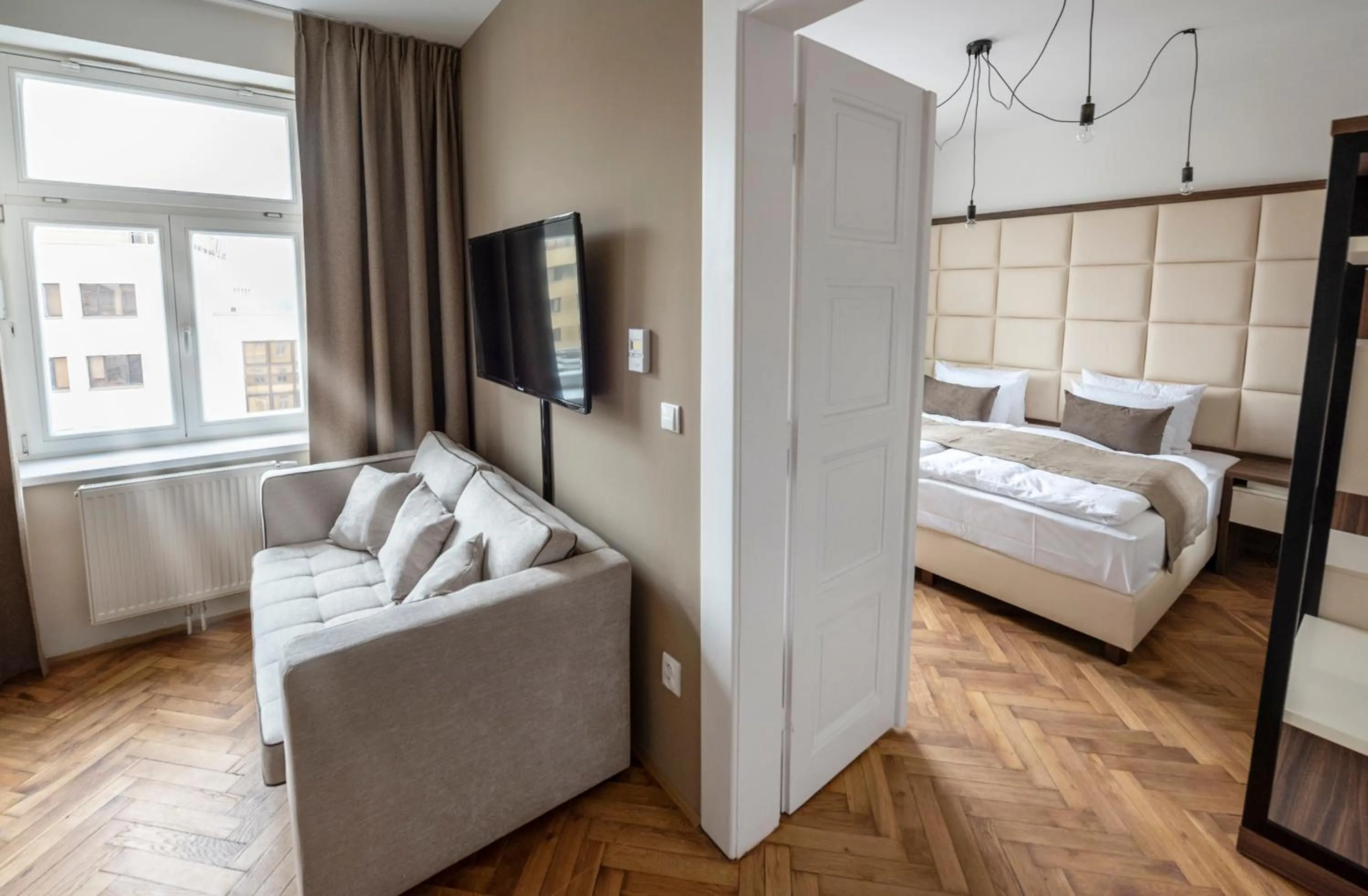 Bed in Letna Garden Suites