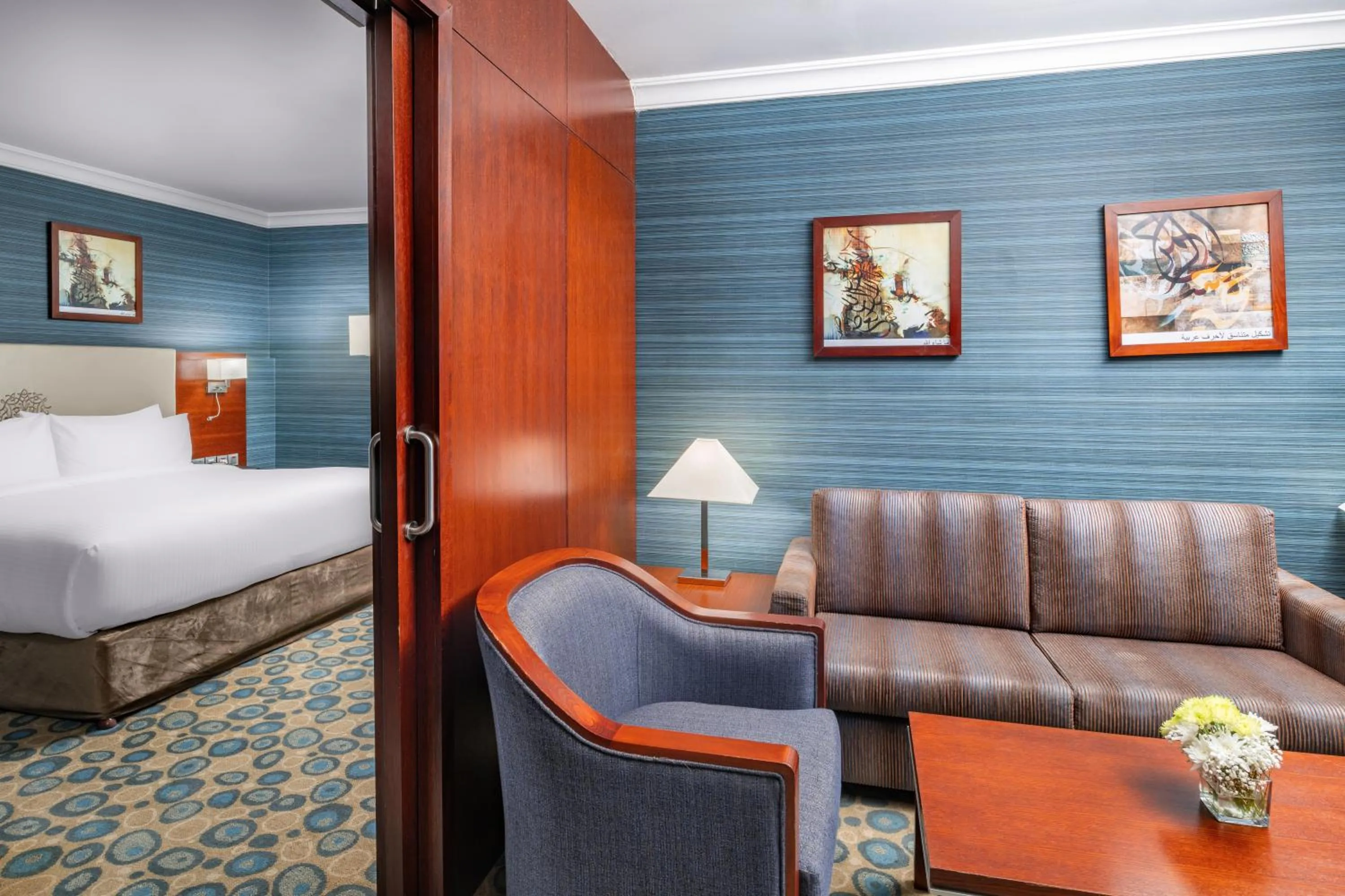 Bed in Millennium Al Aqeeq Hotel