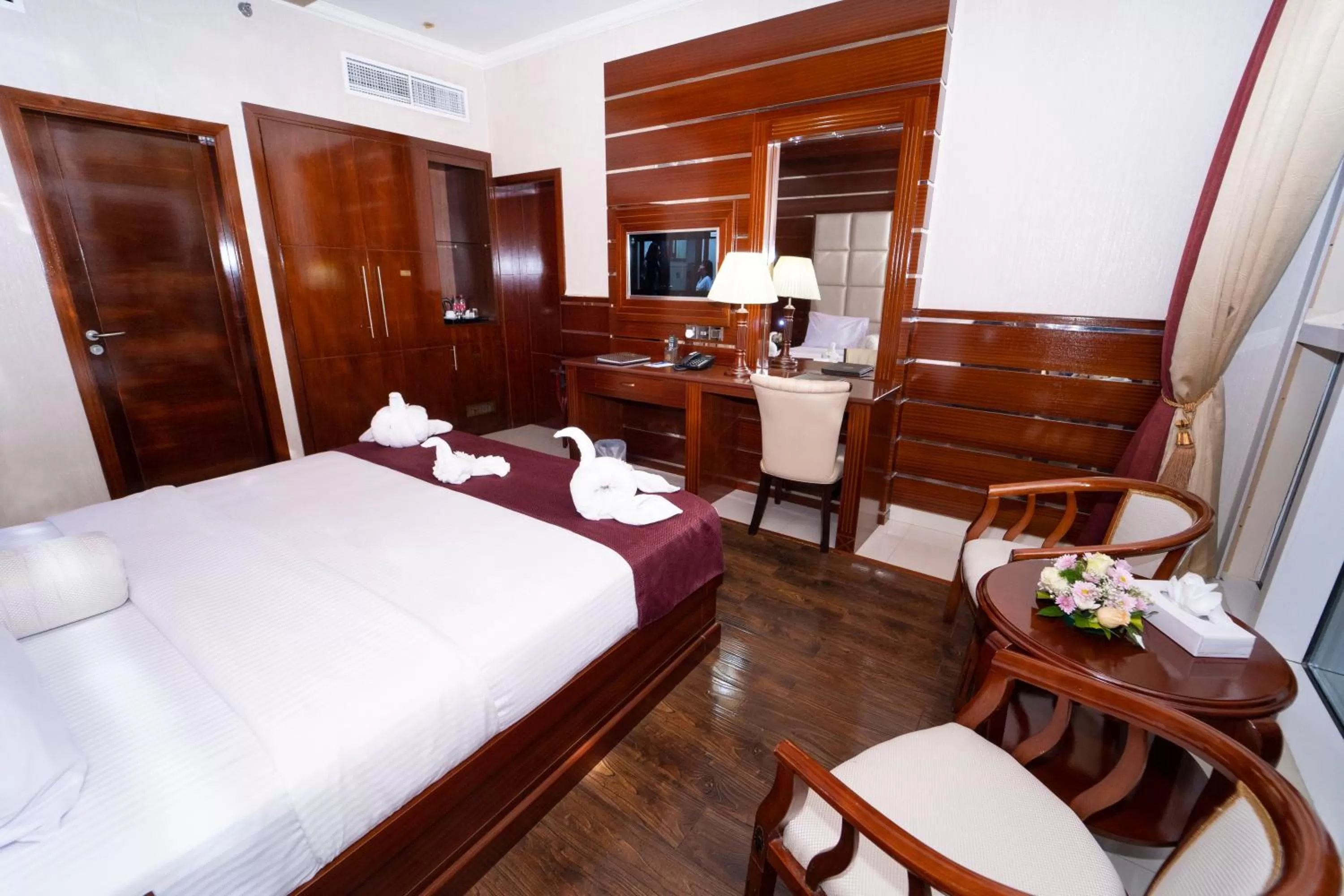 Bed in Queen Palace Hotel