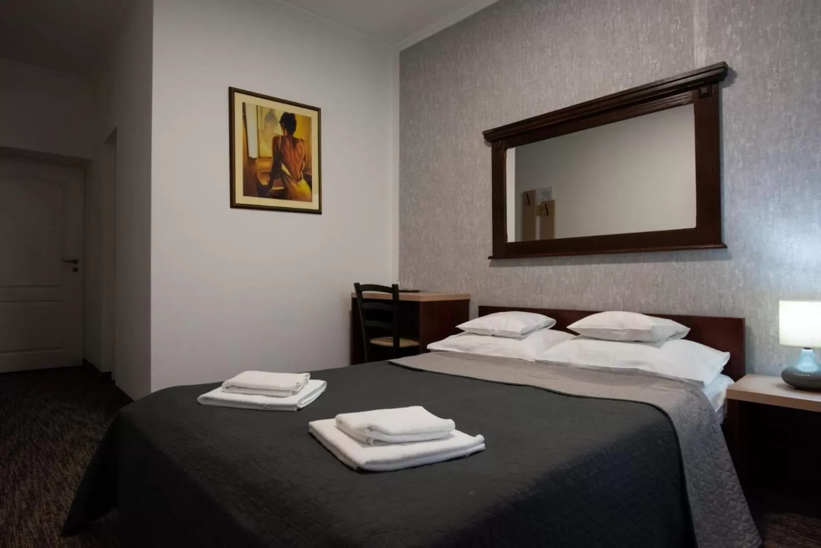 Bed in Carnival City Hotel Oradea