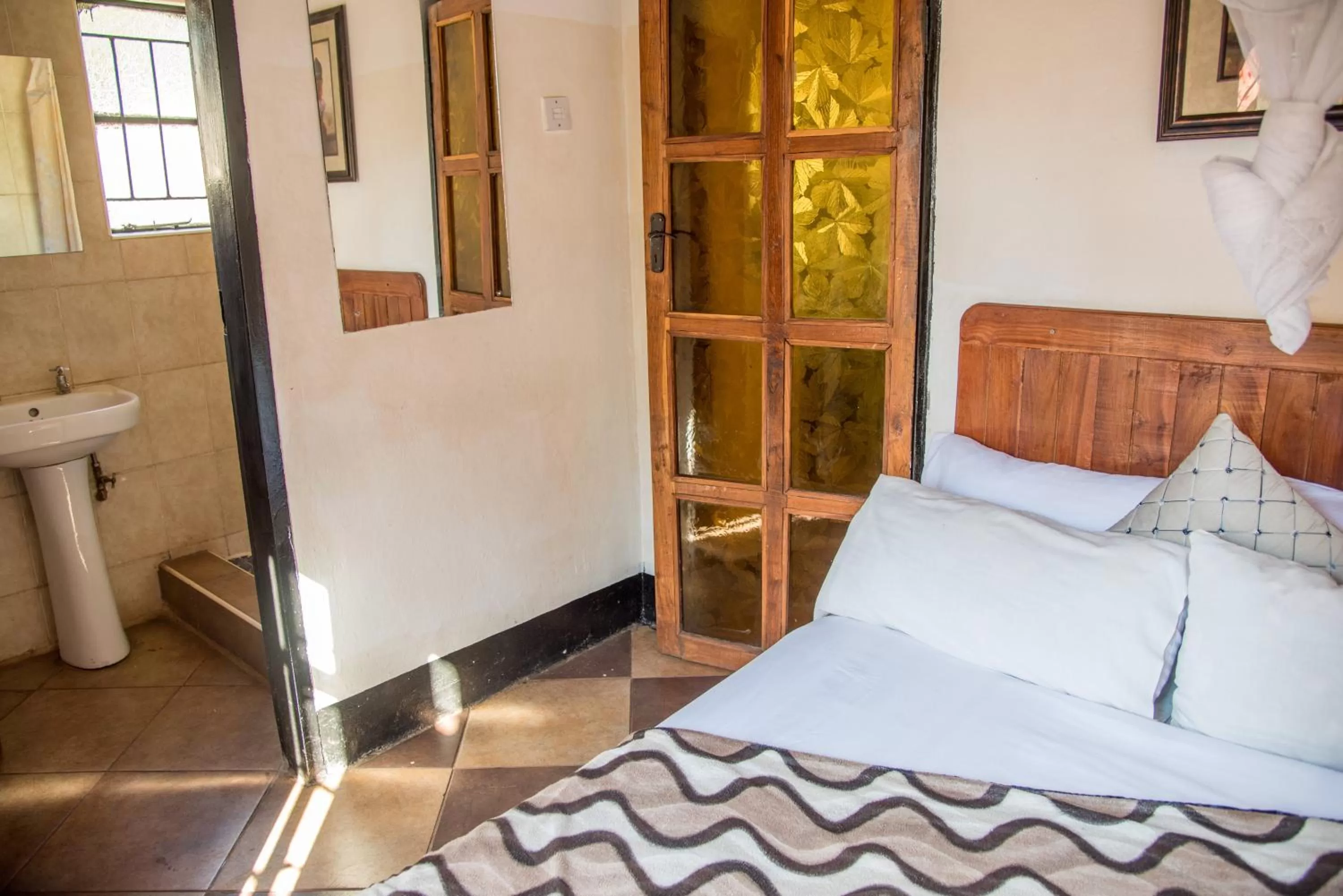 Photo of the whole room, Bed in Okavango Lodge