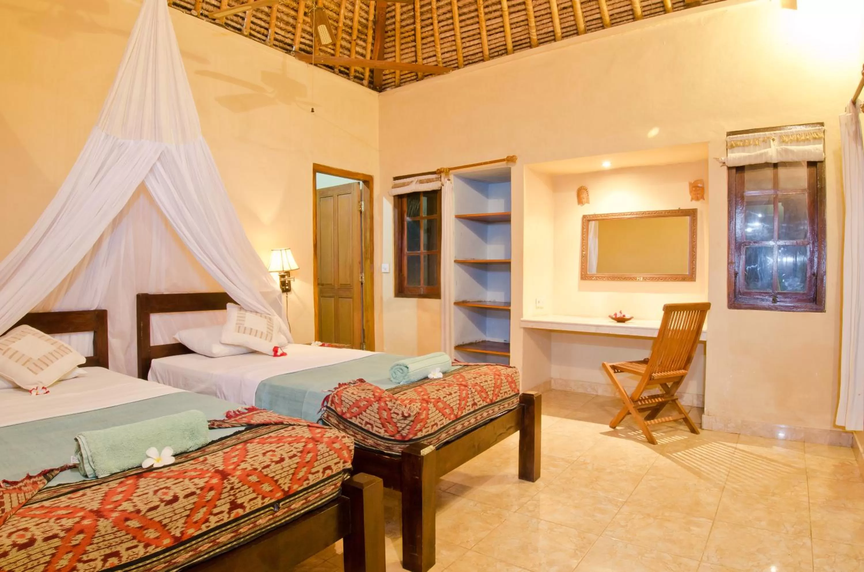 Bed in Mushroom Beach Bungalows