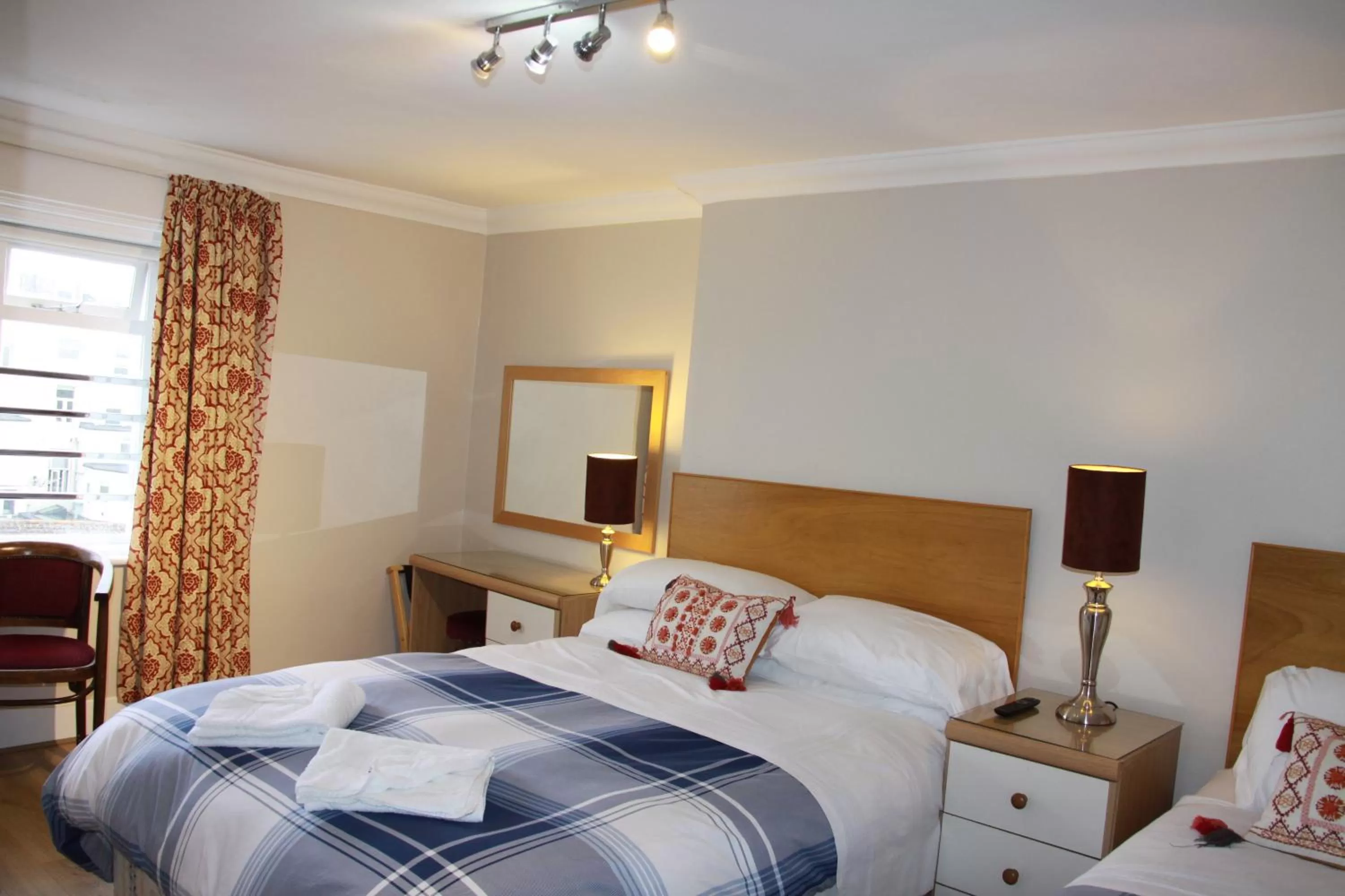 Bed in Ambassador Hotel