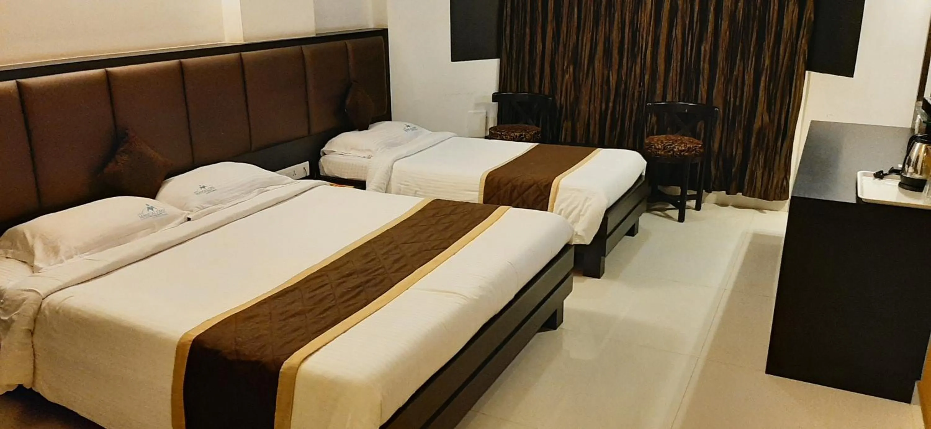 Bed in Hotel Mangalore International