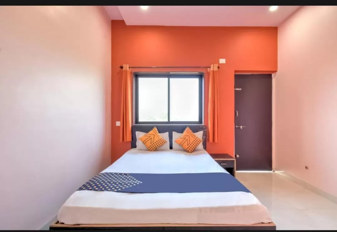 Bed in Hotel Nisarg Lodging And Restaurant