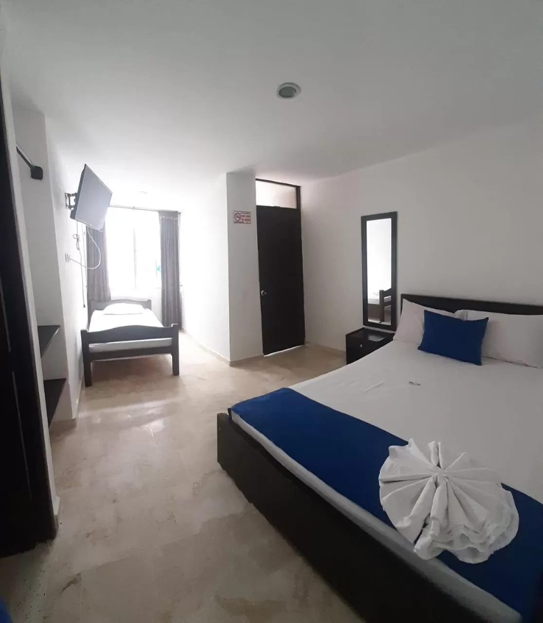 Bed in Blue Star Hotel