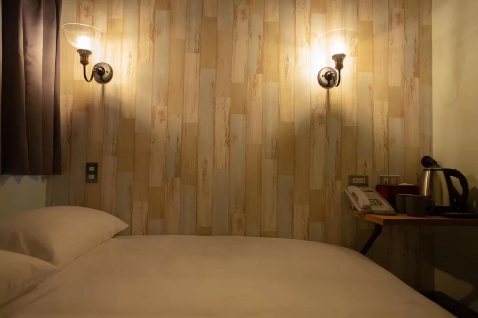 Bed in The Rooms Inn